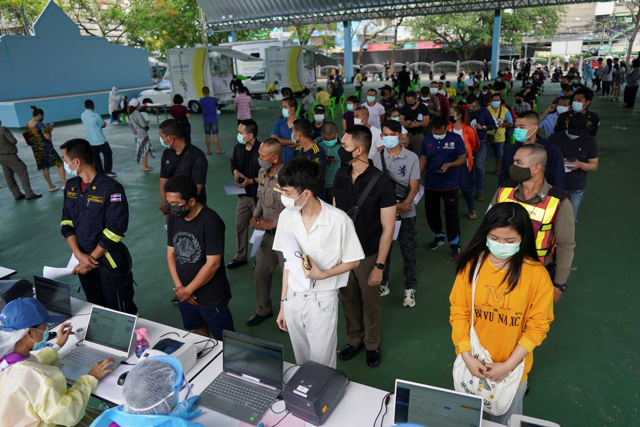 People queue to be tested for the coronavirus disease (COVID-19), as the country deals with a fresh wave of infections after tackling earlier outbreaks, in Bangkok, Thailand April 16, 2021. REUTERS