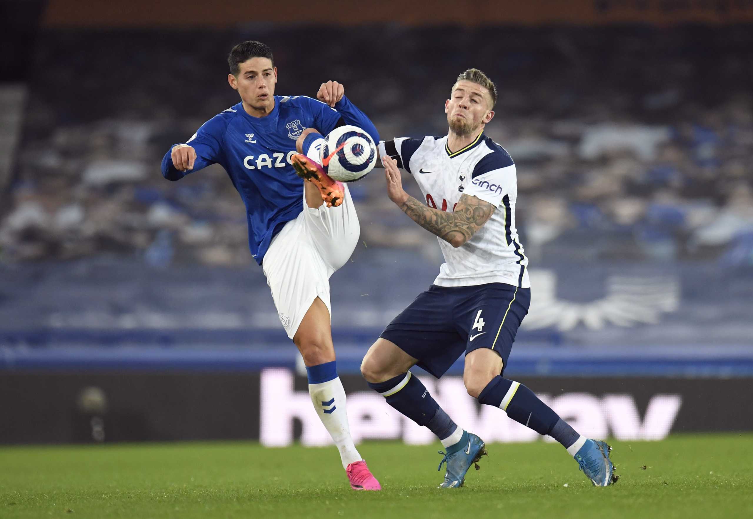 Soccer Football - Premier League - Everton v Tottenham Hotspur - Goodison Park, Liverpool, Britain - April 16, 2021 Everton's James Rodriguez in action with Tottenham Hotspur's Toby Alderweireld Pool via REUTERS