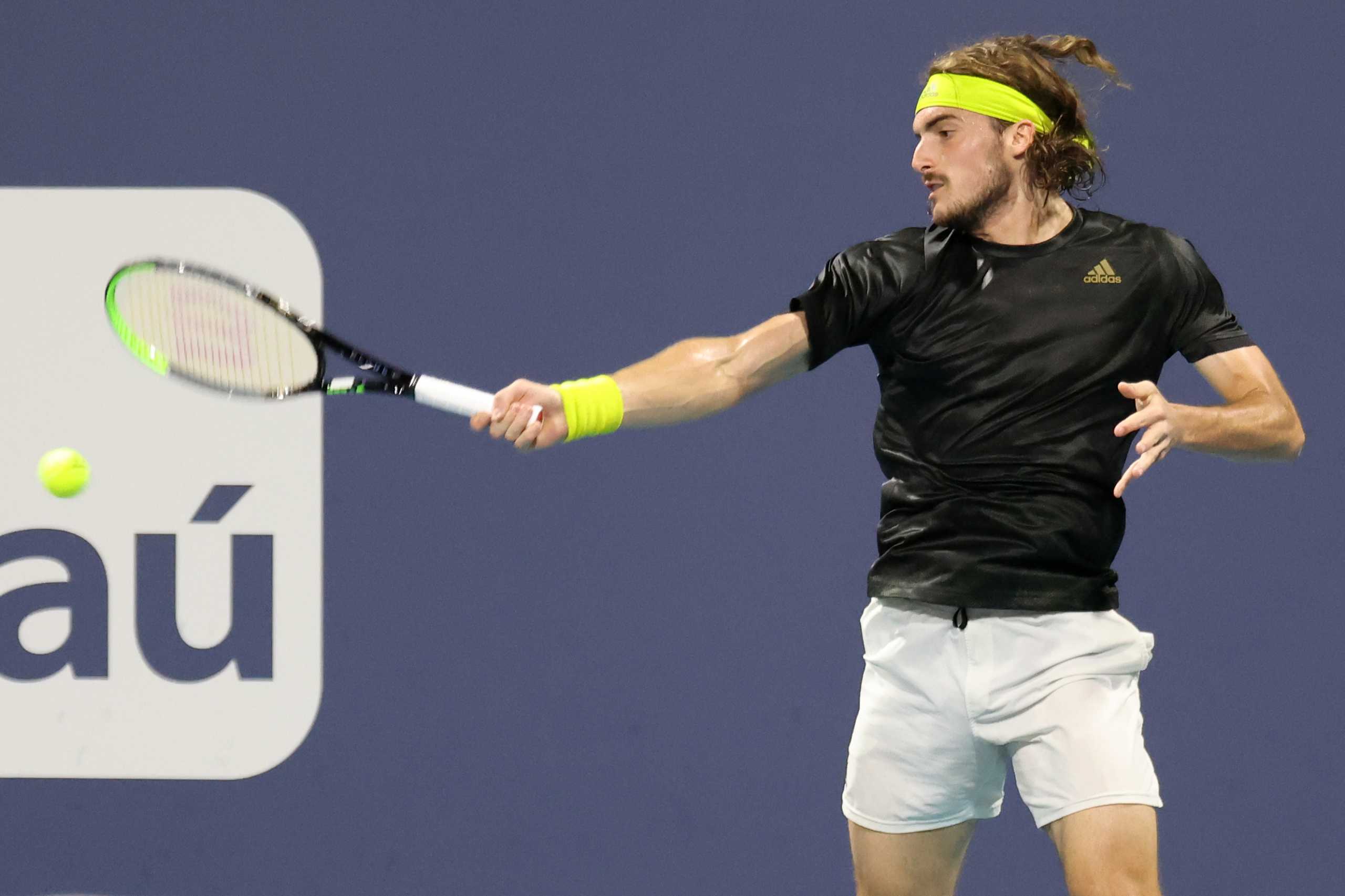 Mar 30, 2021; Miami, Florida, USA; Stefanos Tsitsipas of Greece hits a forehand against Lorenzo Sonego of Italy (not pictured) in the fourth round in the Miami Open at Hard Rock Stadium. Mandatory Credit: Geoff Burke-USA TODAY Sports