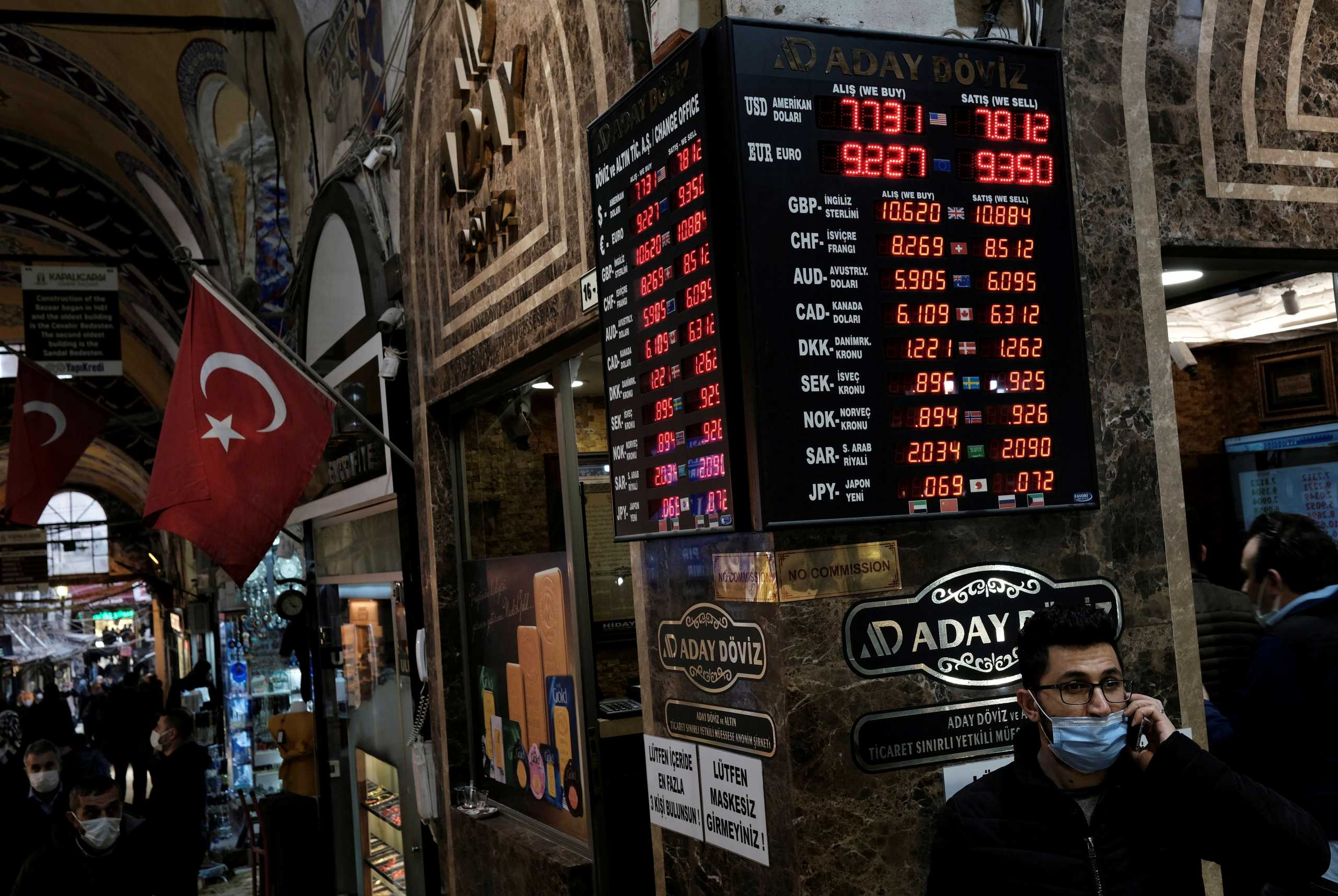 FILE PHOTO: A board shows the currency exchange rates outside an exchange office in Istanbul, Turkey March 22, 2021. REUTERS