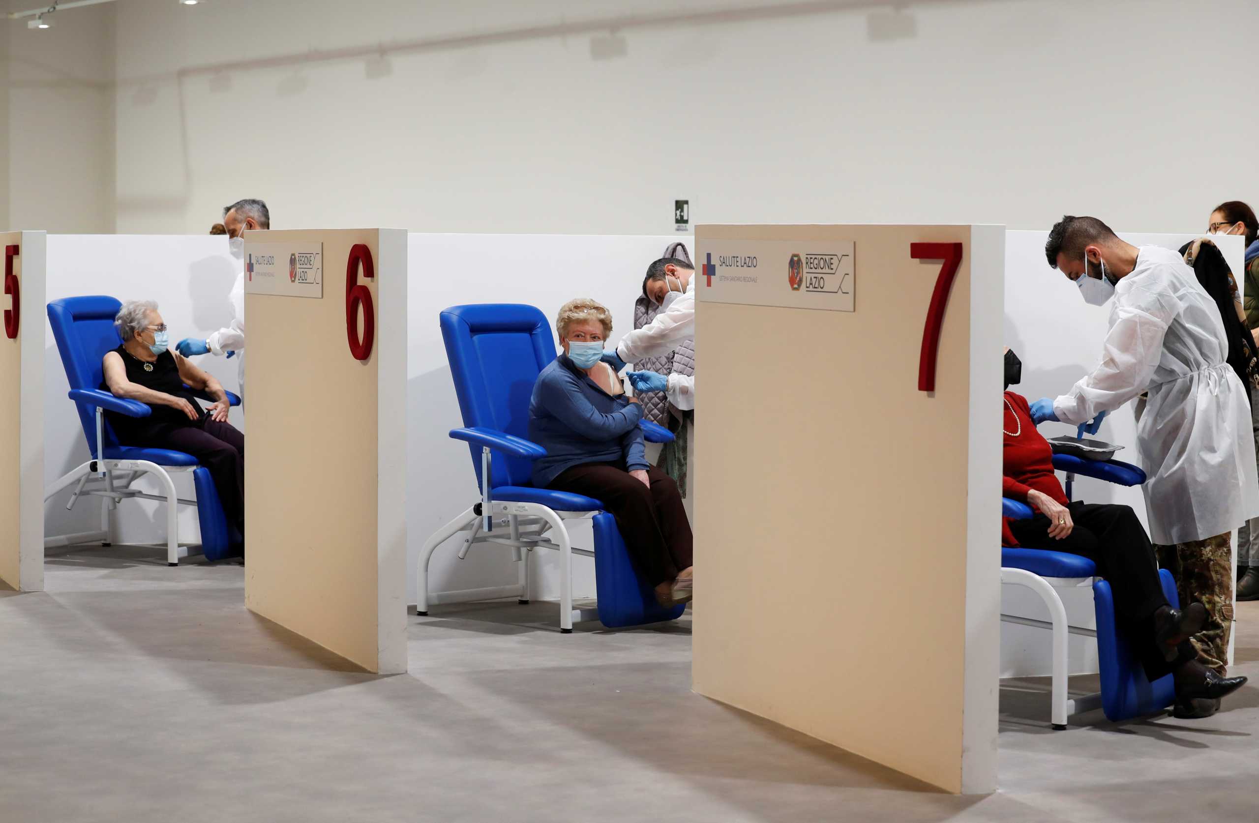 Women receive the Moderna vaccine against the coronavirus disease (COVID-19) at the Music Auditorium in Rome, Italy, April 14, 2021. REUTERS