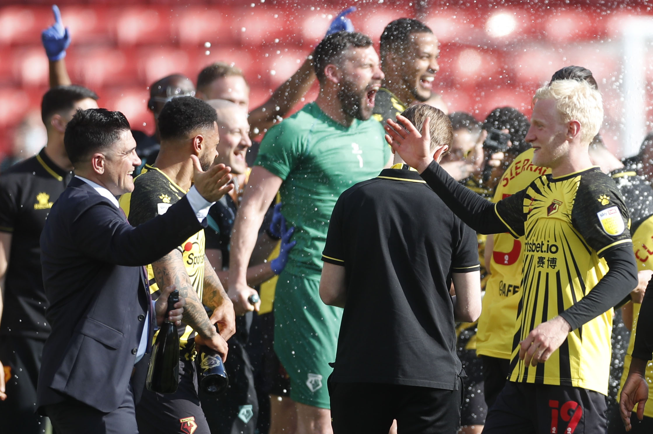 Soccer Football - Championship - Watford v Millwall - Vicarage Road, Watford, Britain - April 24, 2021 Watford's Will Hughes and manager Xisco Munoz celebrate promotion to the Premier League after the match Action Images via Reuters