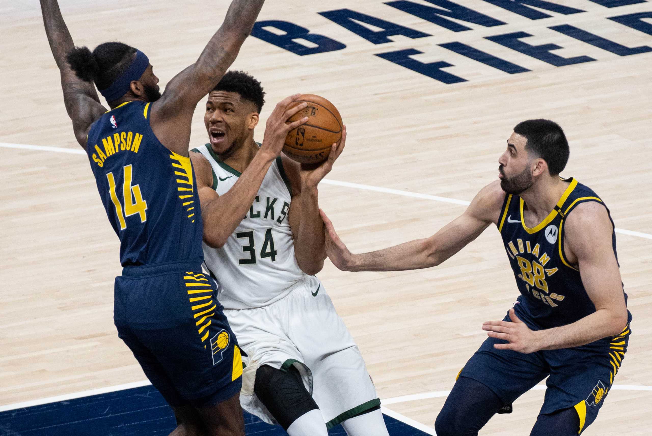 May 13, 2021; Indianapolis, Indiana, USA; Milwaukee Bucks forward Giannis Antetokounmpo (34) drives to the basket while Indiana Pacers forward JaKarr Sampson (14) defends  in the second quarter at Bankers Life Fieldhouse. Mandatory Credit: Trevor Ruszkowski-USA TODAY Sports