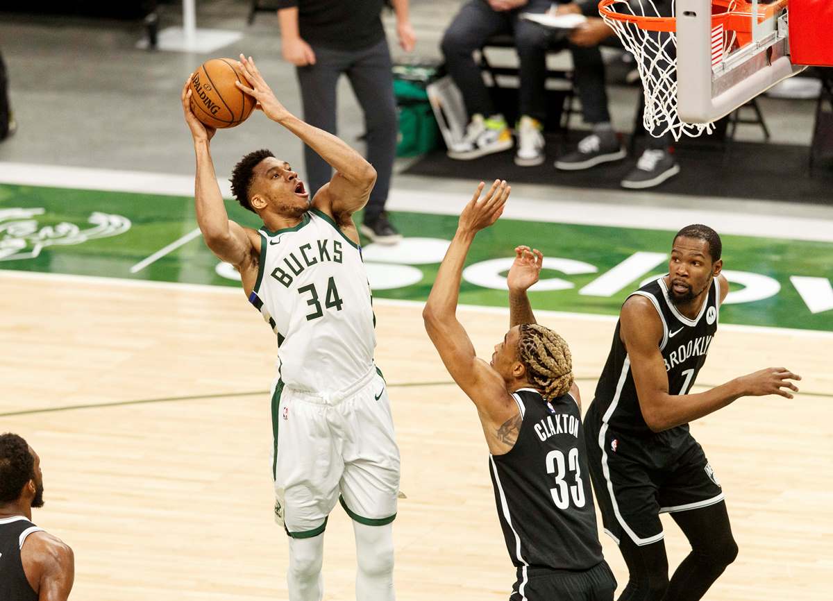 May 4, 2021; Milwaukee, Wisconsin, USA;  Milwaukee Bucks forward Giannis Antetokounmpo (34) shoots over Brooklyn Nets forward Nicolas Claxton (33) during the second quarter at Fiserv Forum. Mandatory Credit: Jeff Hanisch-USA TODAY Sports