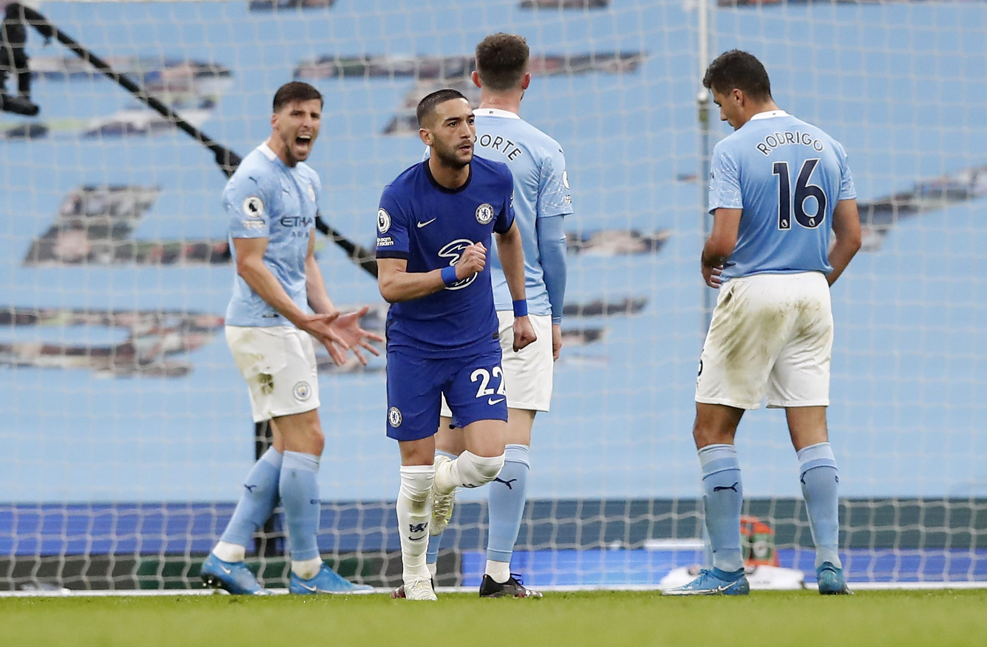 Soccer Football - Premier League - Manchester City v Chelsea - Etihad Stadium, Manchester, Britain - May 8, 2021 Chelsea's Hakim Ziyech celebrates scoring their first goal as Manchester City's Ruben Dias reacts Pool via REUTERS