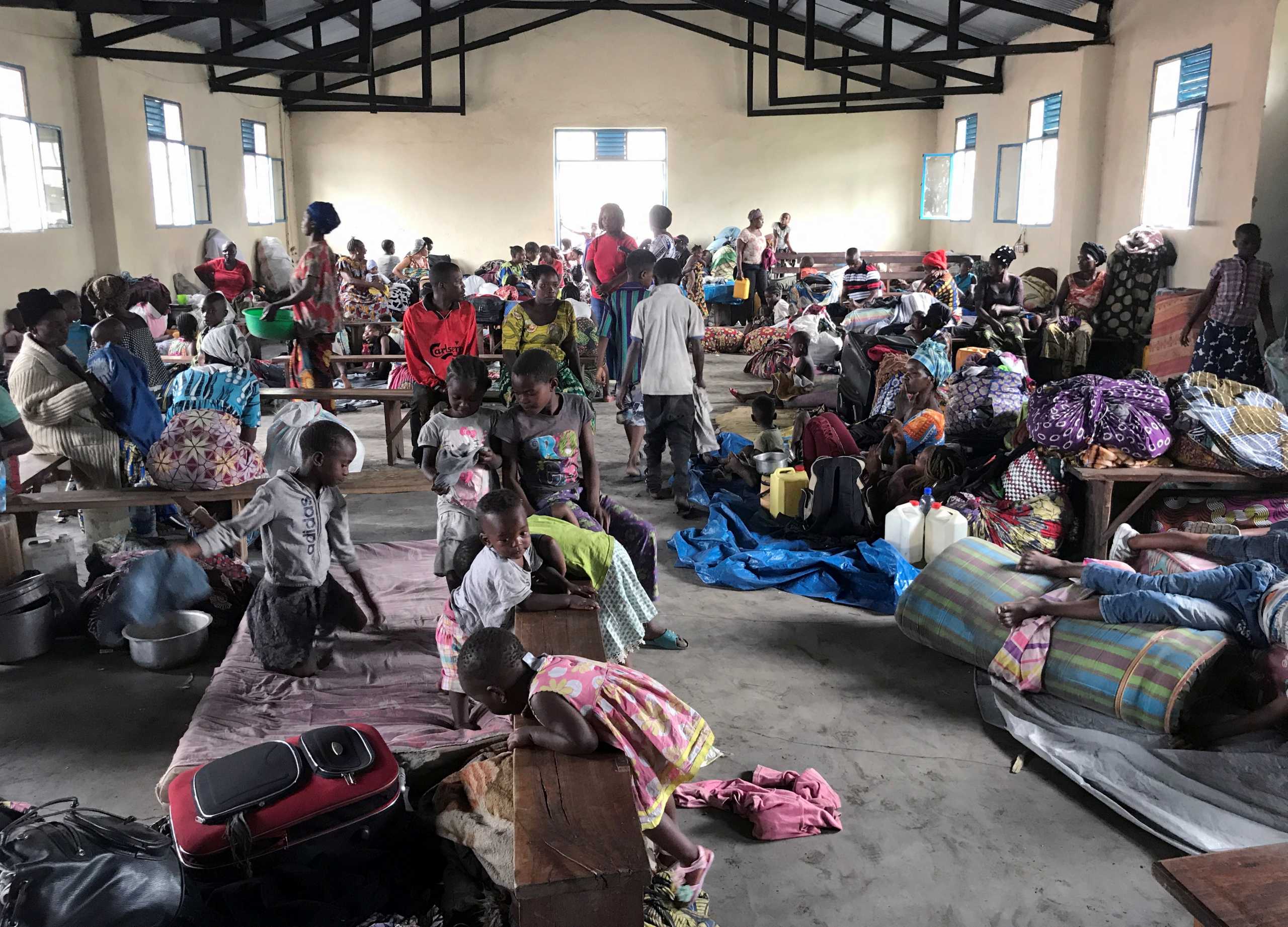Internally displaced Congolese women and children who fled from recurrent earth tremors after the volcanic eruption of Mount Nyiragongo, shelter inside a church in Sake town, near Goma, in the Democratic Republic of Congo May 28, 2021. REUTERS