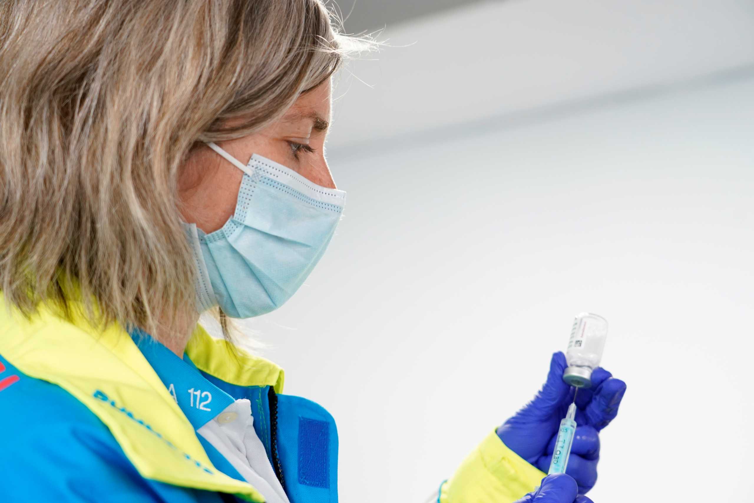 Beatriz Martinez Parra, nurse at SUMMA 112 medical emergency service, prepares a syringe with a dose of the AstraZeneca?s coronavirus disease (COVID-19) vaccine at WiZink sports arena, during the International Nurses Day in Madrid, Spain, May 12, 2021. REUTERS