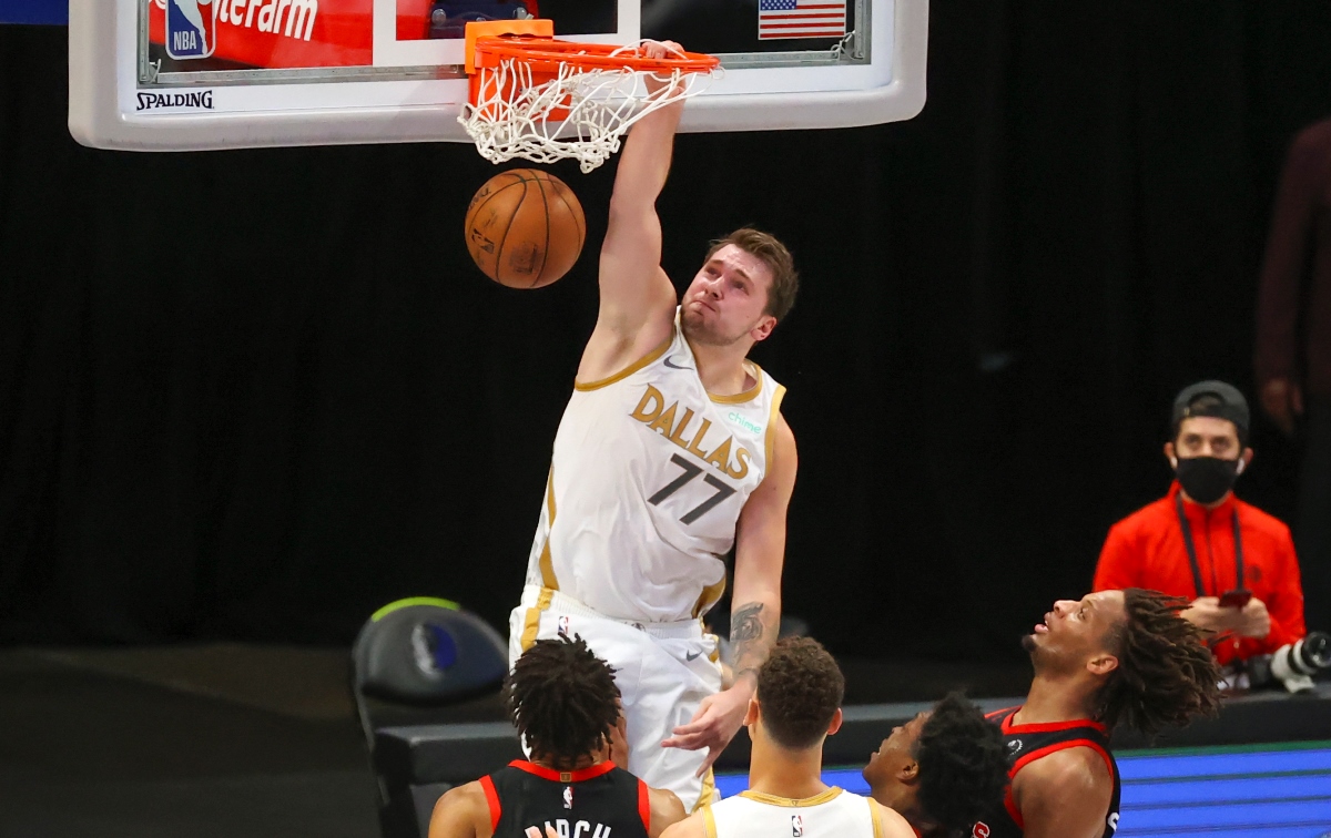 May 14, 2021; Dallas, Texas, USA;  Dallas Mavericks guard Luka Doncic (77) dunks during the fourth quarter against the Toronto Raptors at American Airlines Center. Mandatory Credit: Kevin Jairaj-USA TODAY Sports