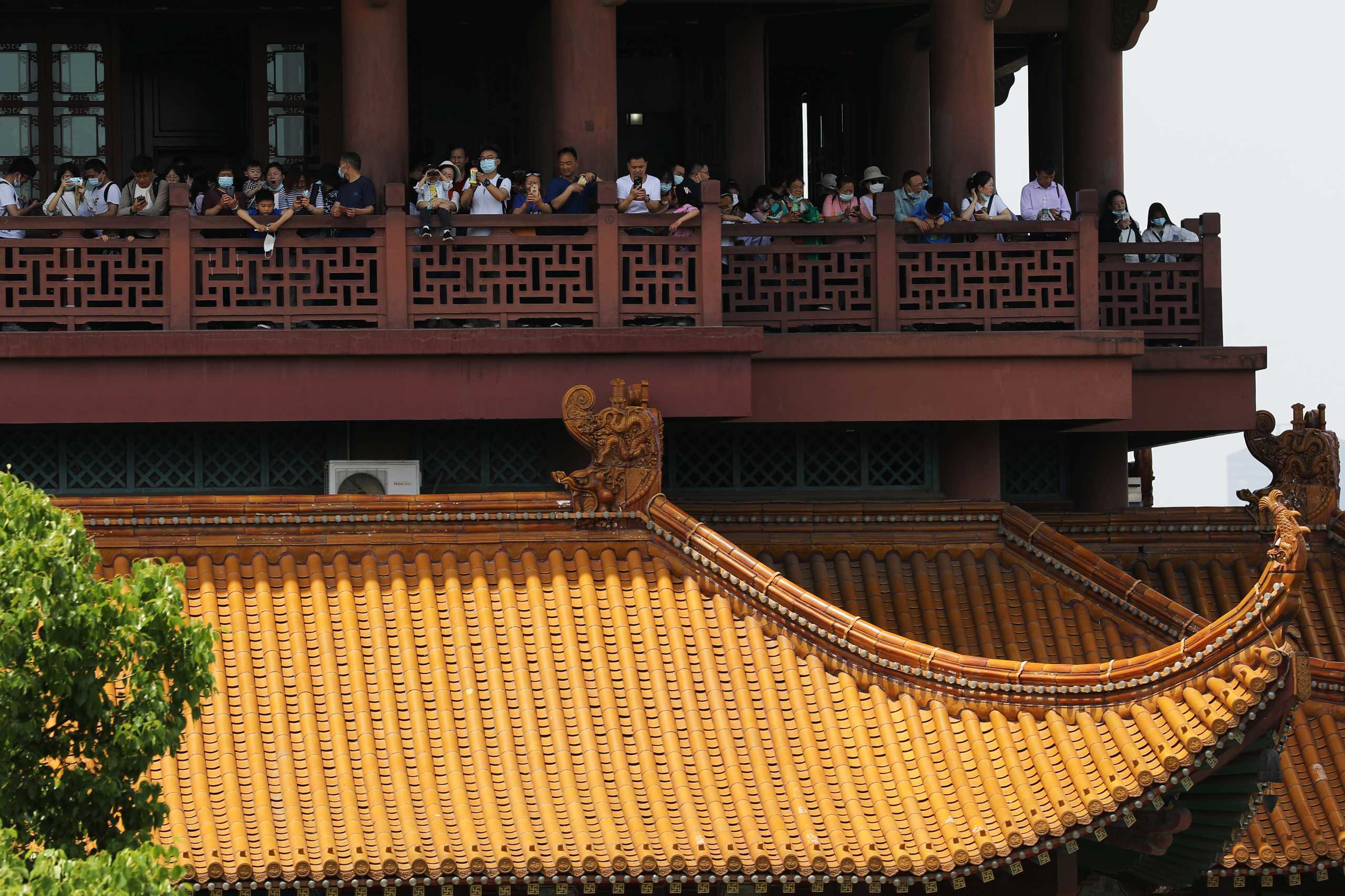 Visitors are seen on the Yellow Crane Tower during the Labour Day holiday in Wuhan, Hubei province, China May 2, 2021. REUTERS