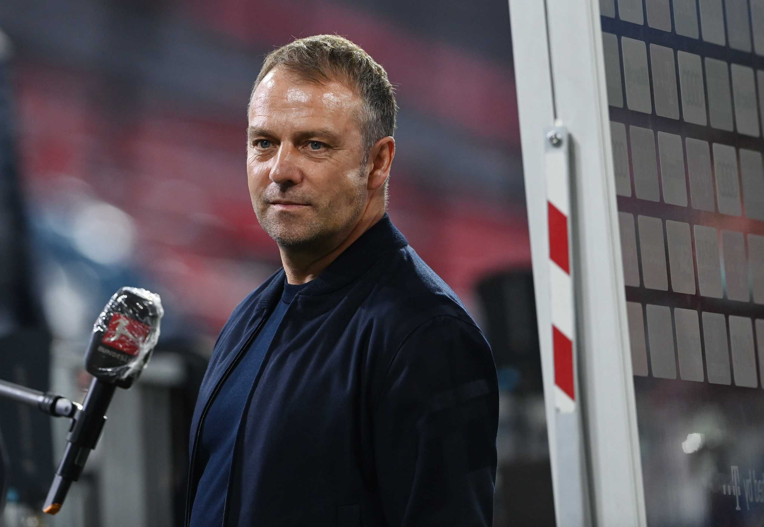 Soccer Football - Bundesliga - Bayern Munich v Borussia Moenchengladbach - Allianz Arena, Munich, Germany - May 8, 2021 Bayern Munich coach Hansi Flick being interviewed after the match after winning the Bundesliga Pool via REUTERS