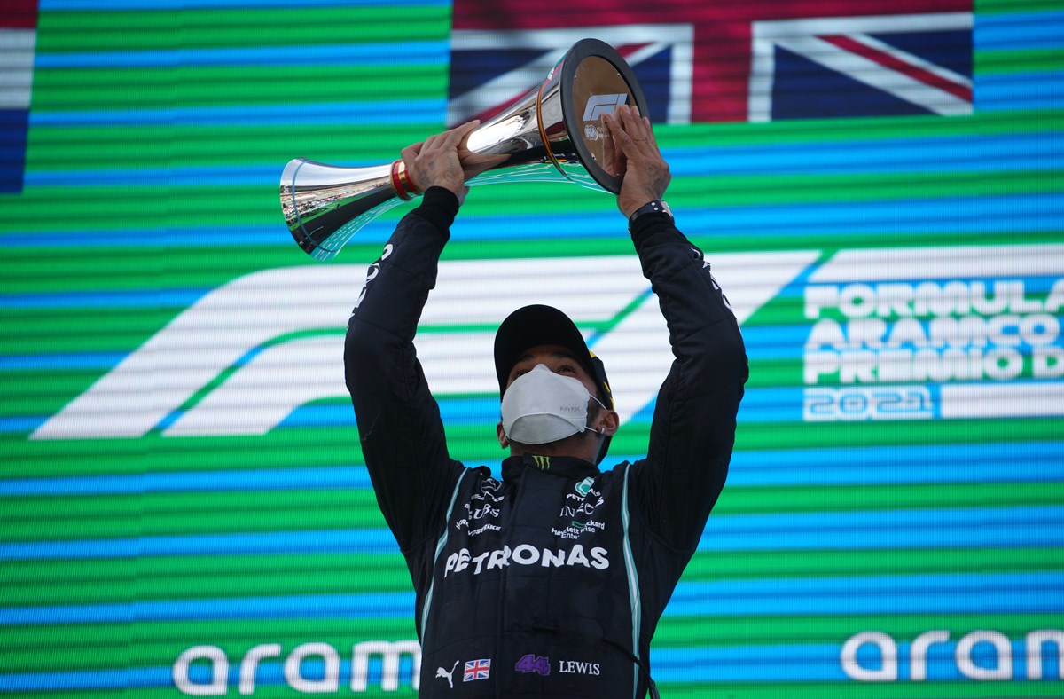 Formula One F1 - Spanish Grand Prix - Circuit de Barcelona-Catalunya, Barcelona, Spain - May 9, 2021 Mercedes' Lewis Hamilton celebrates on the podium with a trophy after winning the race Pool via REUTERS
