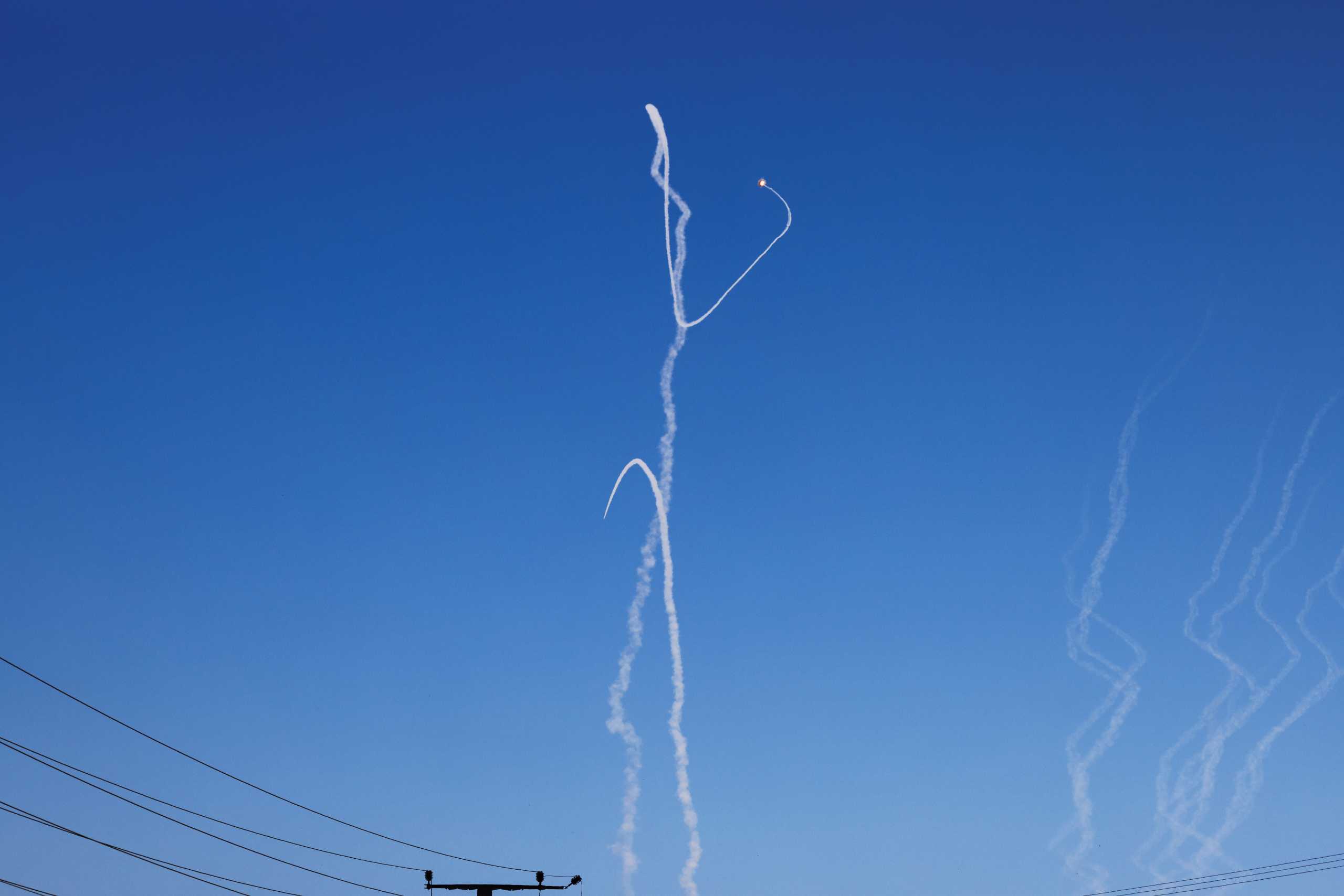 Smoke trails are seen as Israel's Iron Dome anti-missile system intercepts rockets launched from the Gaza Strip towards Israel, as seen near Ashkelon, southern Israel May 18, 2021. REUTERS