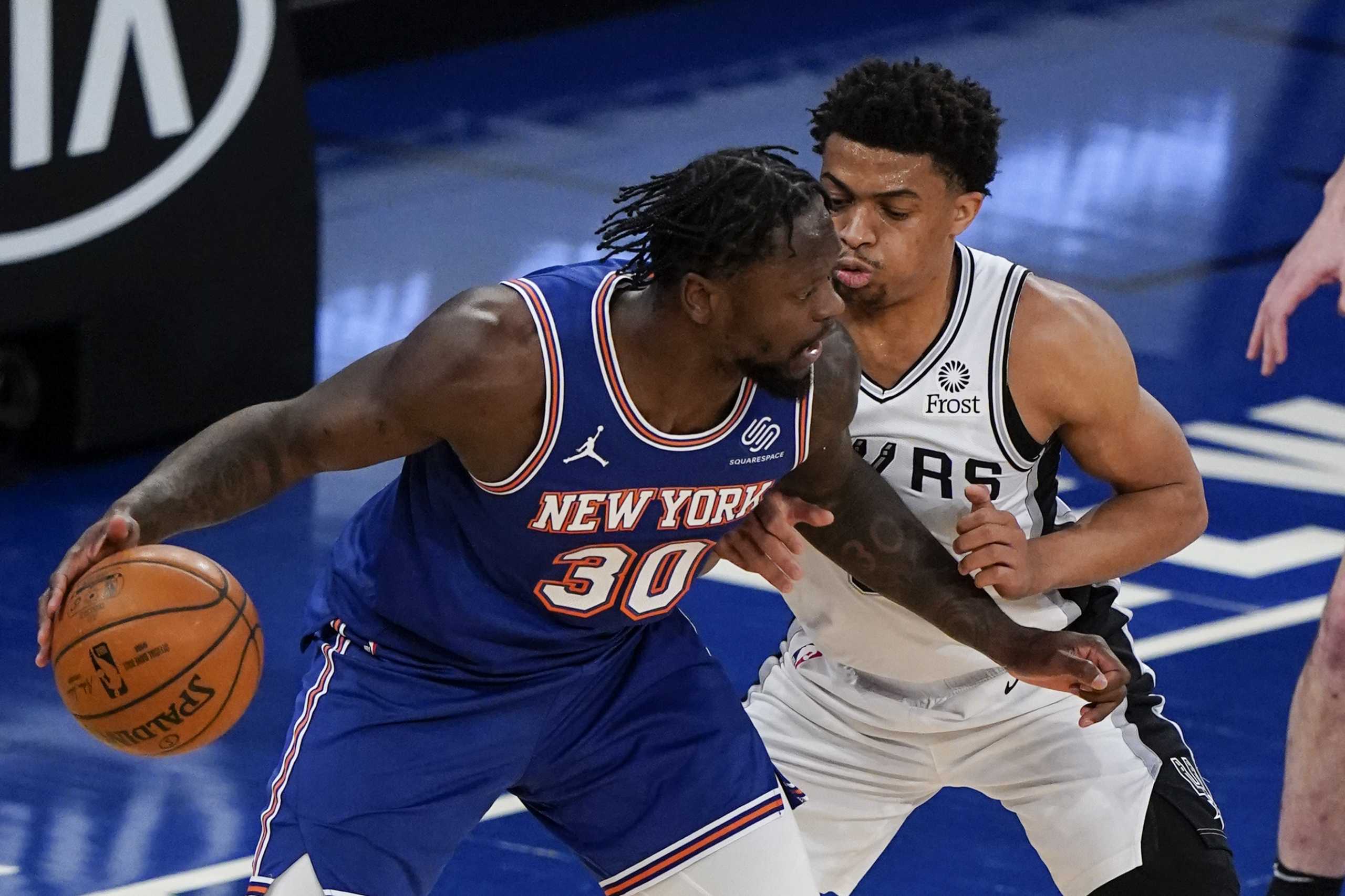 May 13, 2021; New York, New York, USA; New York Knicks' Julius Randle (30) is defended by San Antonio Spurs' Keldon Johnson (3) during the first half at Madison Square Garden. Mandatory Credit: Frank Franklin II