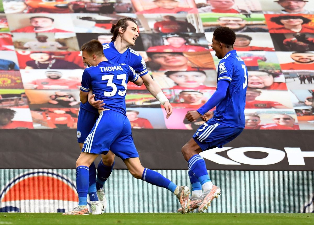 Soccer Football - Premier League - Manchester United v Leicester City - Old Trafford, Manchester, Britain - May 11, 2021 Leicester City's Caglar Soyuncu celebrates scoring their second goal with teammates Pool via REUTERS