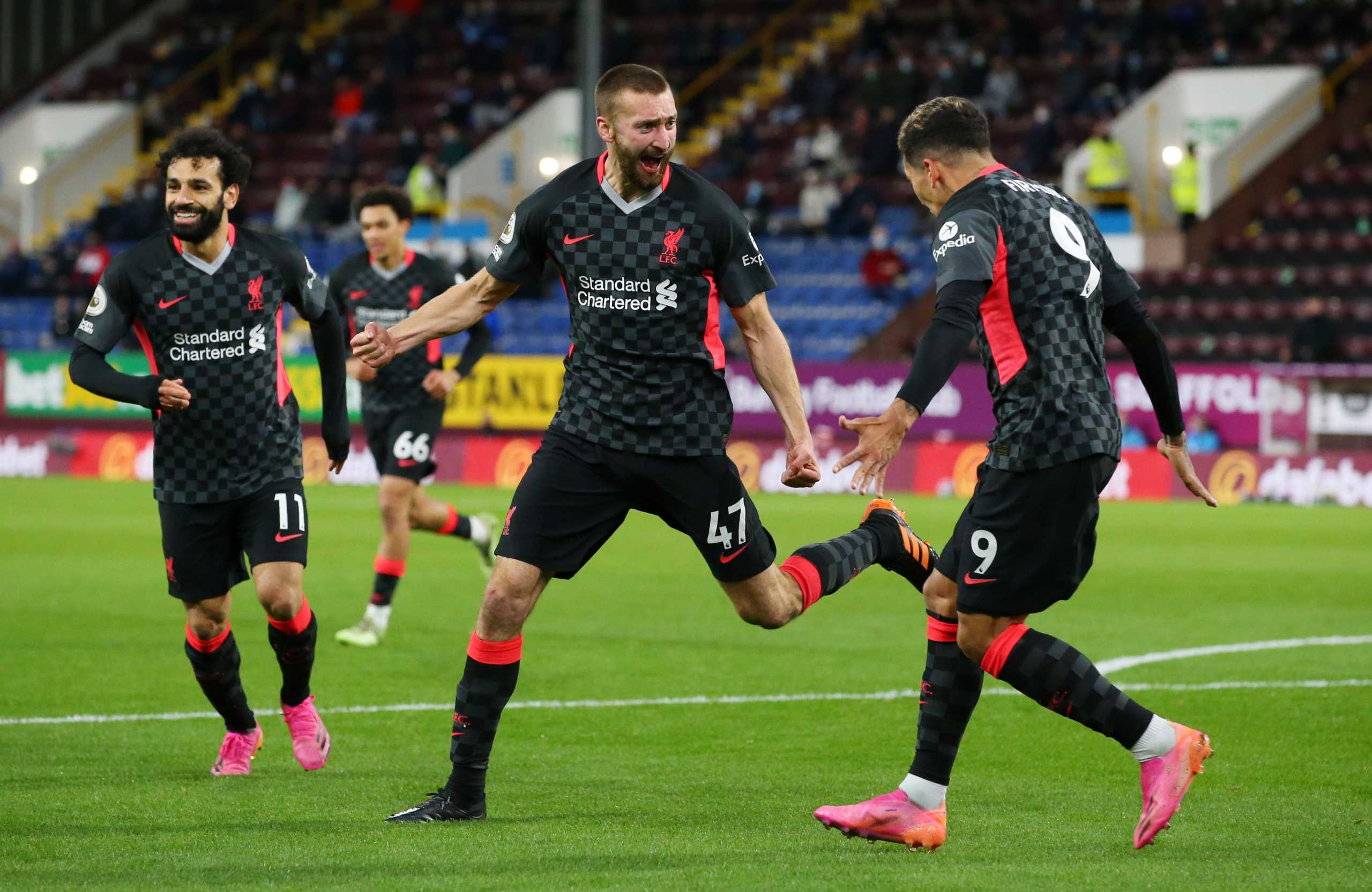 Soccer Football - Premier League - Burnley v Liverpool - Turf Moor, Burnley, Britain - May 19, 2021 Liverpool's Nathaniel Phillips celebrates scoring their second goal with Roberto Firmino Pool via REUTERS