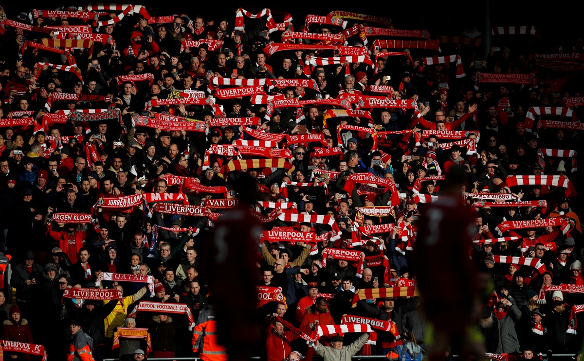 FILE PHOTO: Soccer Football - Premier League - Liverpool v Southampton - Anfield, Liverpool, Britain - February 1, 2020  General view of Liverpool fans holding their scarves aloft before the match   REUTERS