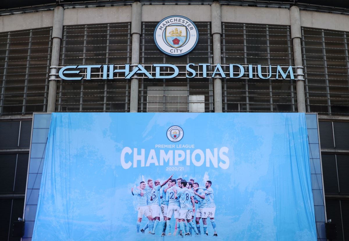 Soccer Football - Premier League - Manchester City fans celebrate winning the Premier League - Etihad Stadium, Manchester, Britain - May 11, 2021  A banner is seen outside the Etihad stadium after Manchester City won the Premier League Action Images via Reuters