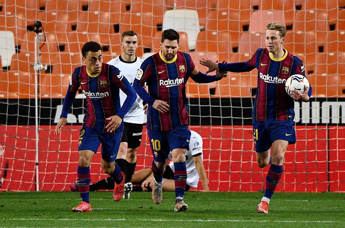 Soccer Football - La Liga Santander - Valencia v FC Barcelona - Mestalla, Valencia, Spain - May 2, 2021 Barcelona's Lionel Messi celebrates scoring their first goal with teammates REUTERS