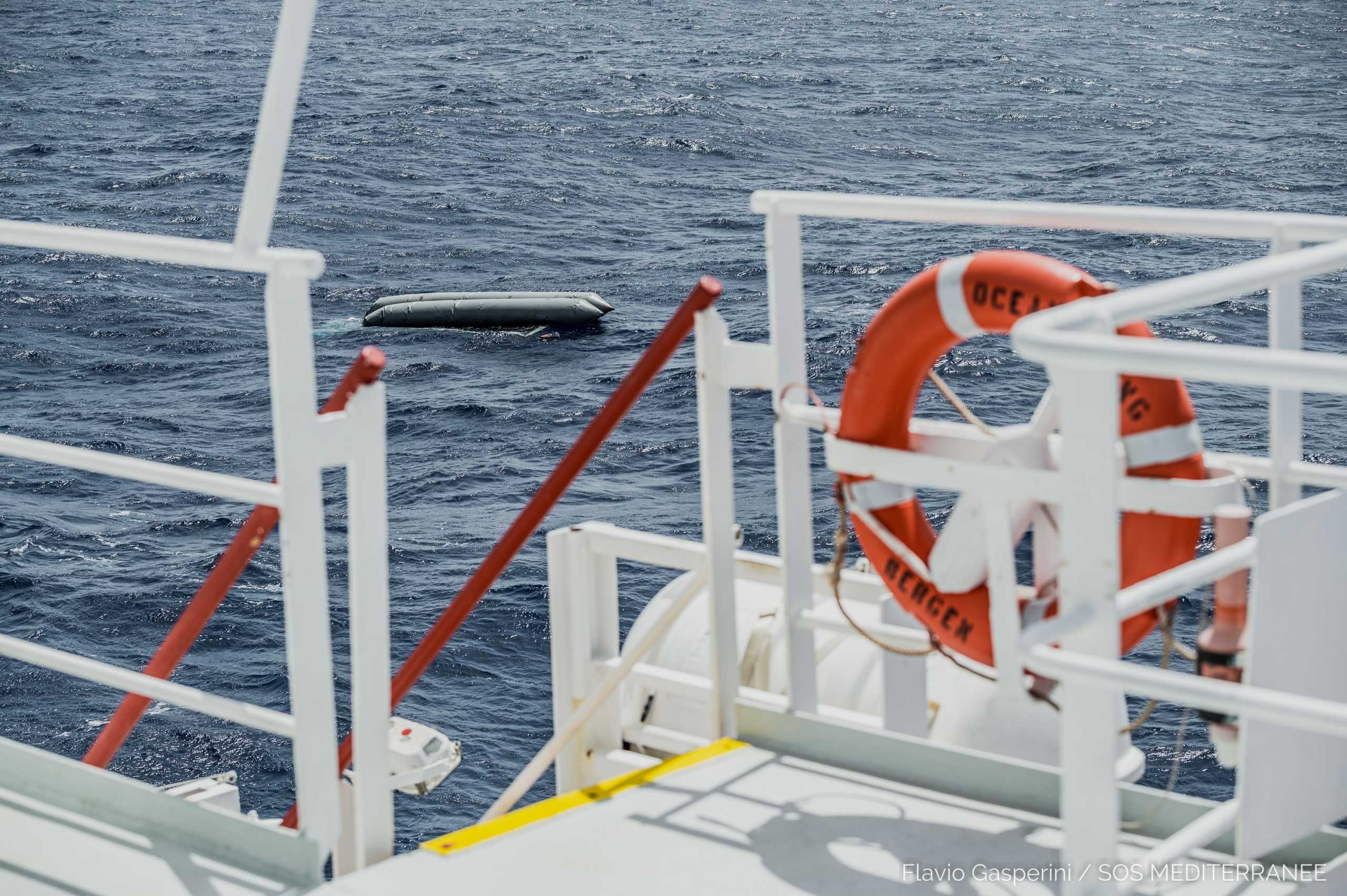 A rubber boat is seen after having capsized with more than 100 migrants on board, during a search and rescue (SAR) operation in the Mediterranean Sea, off the Libyan Coast, April 22, 2021. Picture taken April 22, 2021. Flavio Gasperini