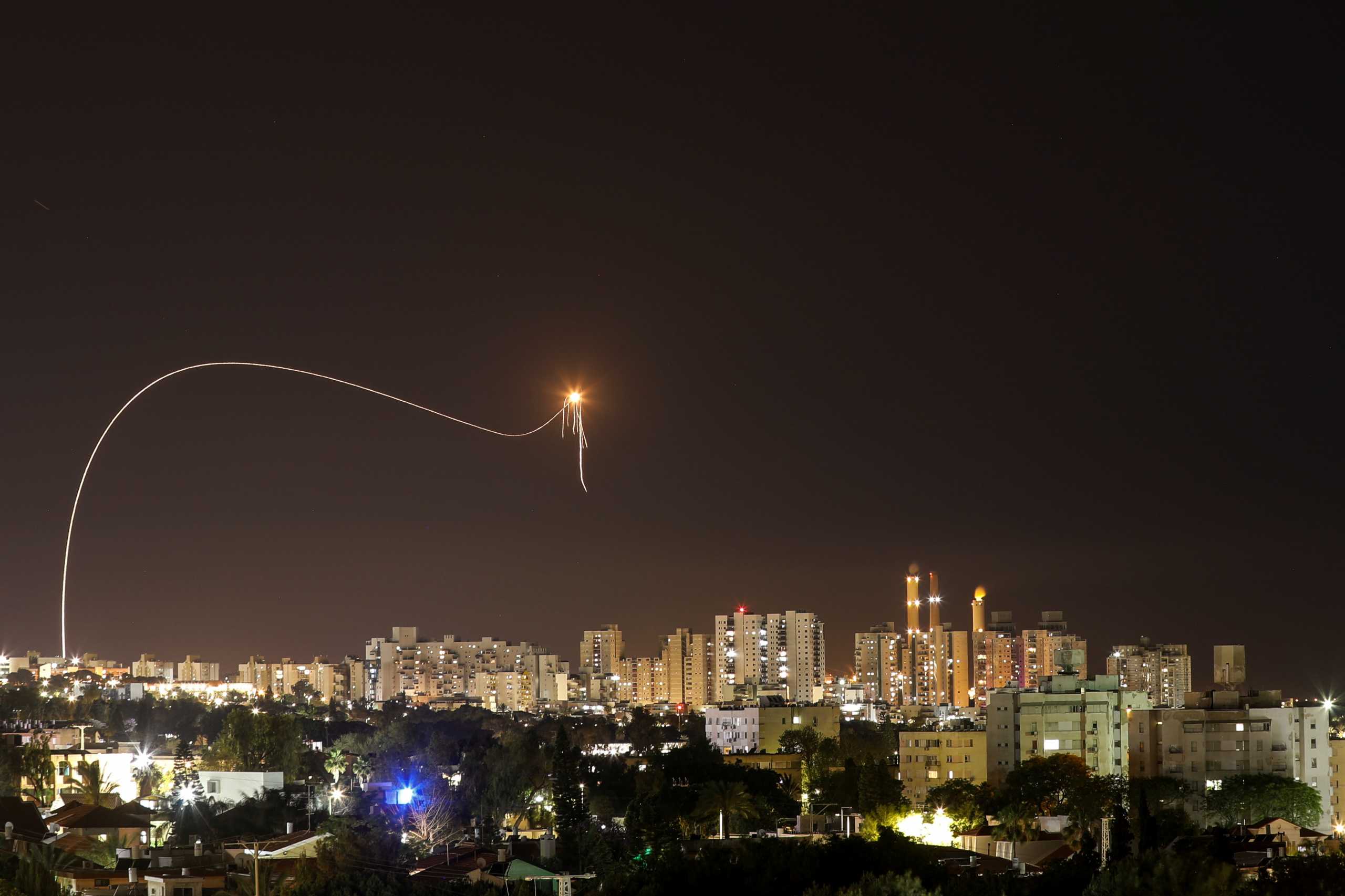 A streak of light is seen as Israel's Iron Dome anti-missile system intercepts rockets launched from the Gaza Strip towards Israel, as seen from Ashkelon, Israel May 16, 2021. REUTERS