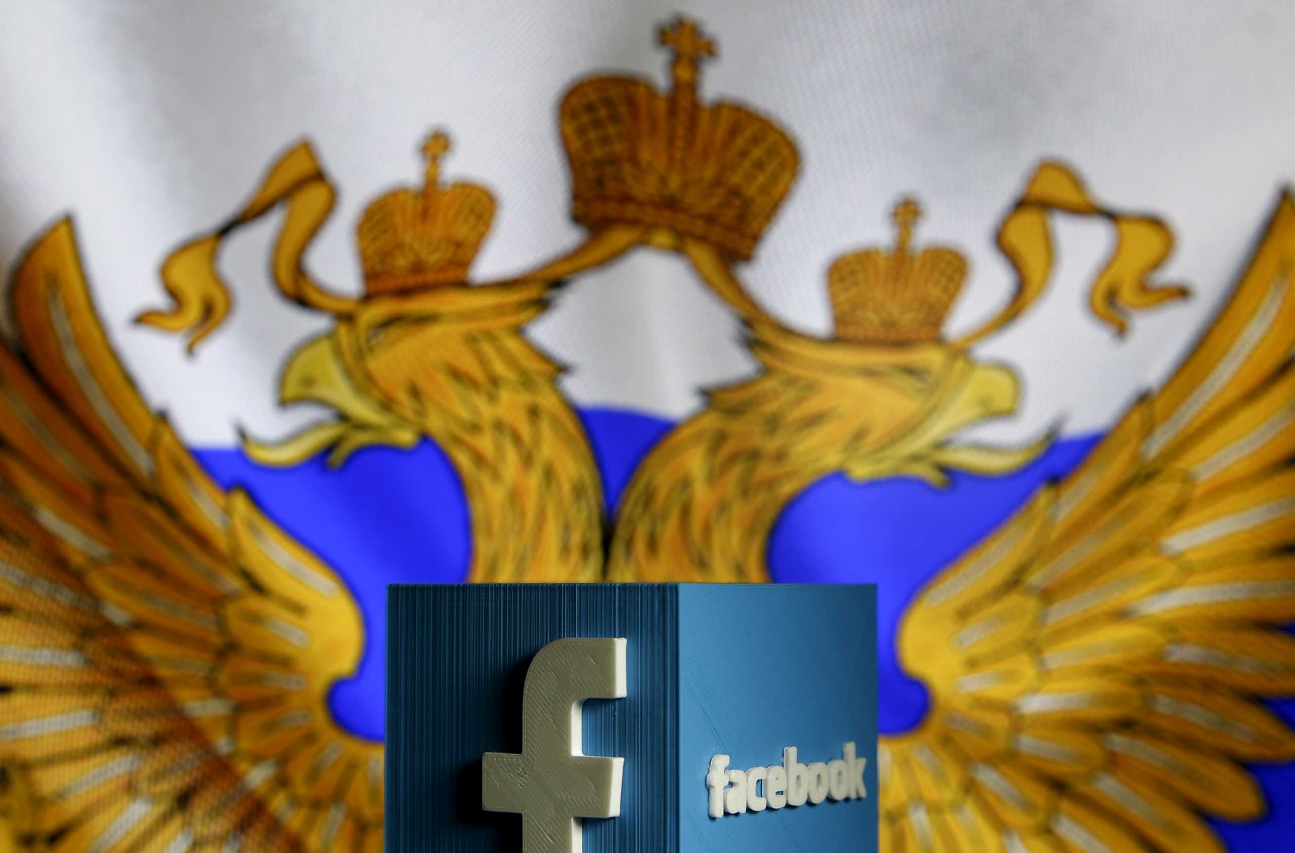 FILE PHOTO: A 3D model of the Facebook logo is seen in front of a Russian flag in this photo illustration taken in Zenica, Bosnia and Herzegovina,  May 22, 2015. REUTERS