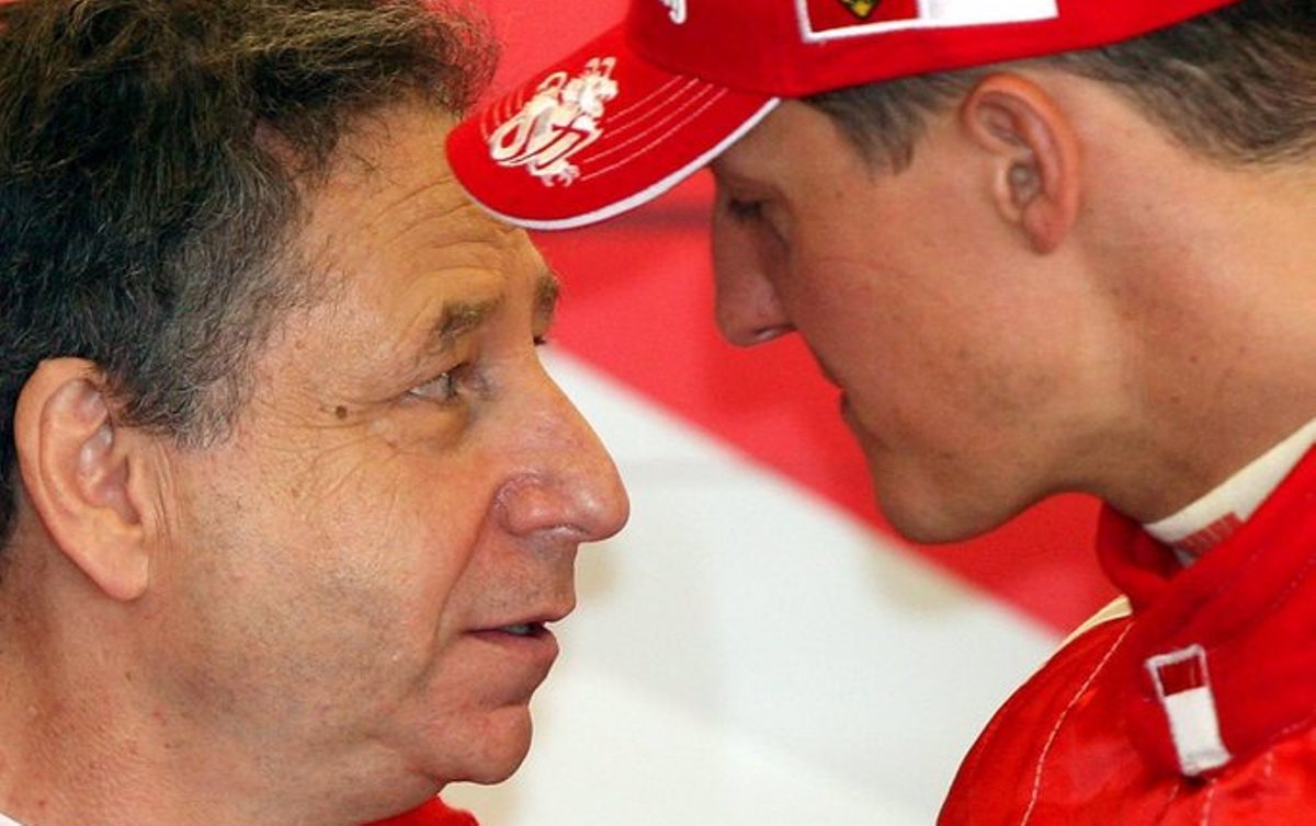 epa00759992 German Formula One driver Michael Schumacher of the Scuderia Ferrari team and teamchief of Scuderia Ferrari F1 team French Jean Todt seen in his garage during the third practice session at the Indianapolis Speed Motorway race track in Indianapolis, United States on Saturday; 01 July 2006. United States Grand Prix will take place on Sunday, 02 July 2006.  EPA