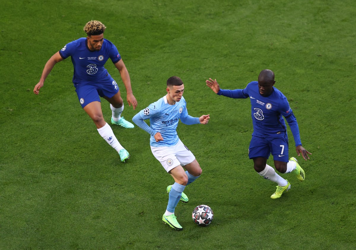 Soccer Football - Champions League Final - Manchester City v Chelsea - Estadio do Dragao, Porto, Portugal - May 29, 2021 Manchester City's Phil Foden in action with Chelsea's N'Golo Kante and Reece James Pool via REUTERS