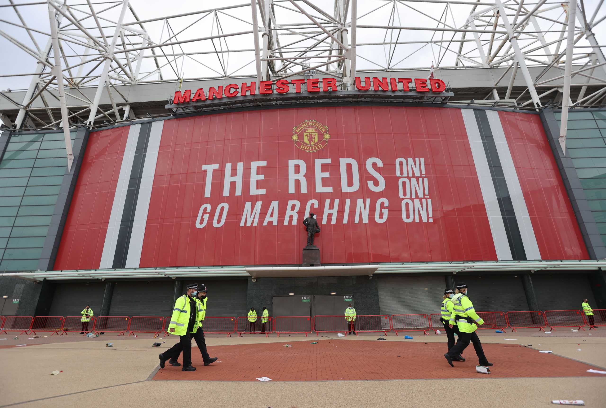 Soccer Football - Manchester United fans protest against their owners before the Manchester United v Liverpool Premier League match - Old Trafford, Manchester, Britain - May 2, 2021 General view outside the stadium as Manchester United fans protest against their owners before the match Action Images via REUTERS