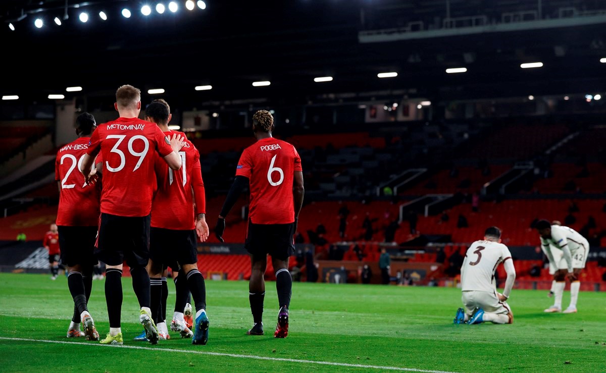 Soccer Football - Europa League - Semi Final First Leg - Manchester United v AS Roma - Old Trafford, Manchester, Britain - April 29, 2021 Manchester United's Mason Greenwood celebrates scoring their sixth goal with teammates REUTERS