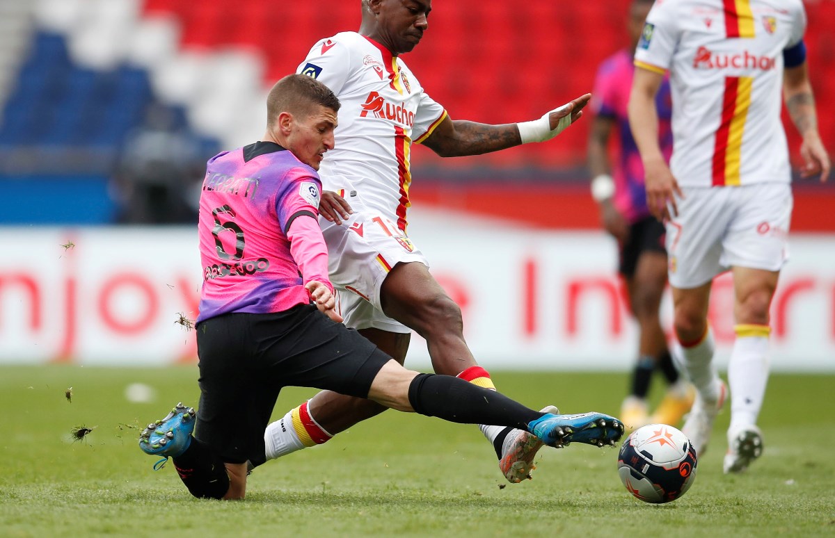 Soccer Football - Ligue 1 - Paris St Germain v RC Lens - Parc des Princes, Paris, France - May 1, 2021 RC Lens' Steven Fortes in action with Paris St Germain's Marco Verratti REUTERS