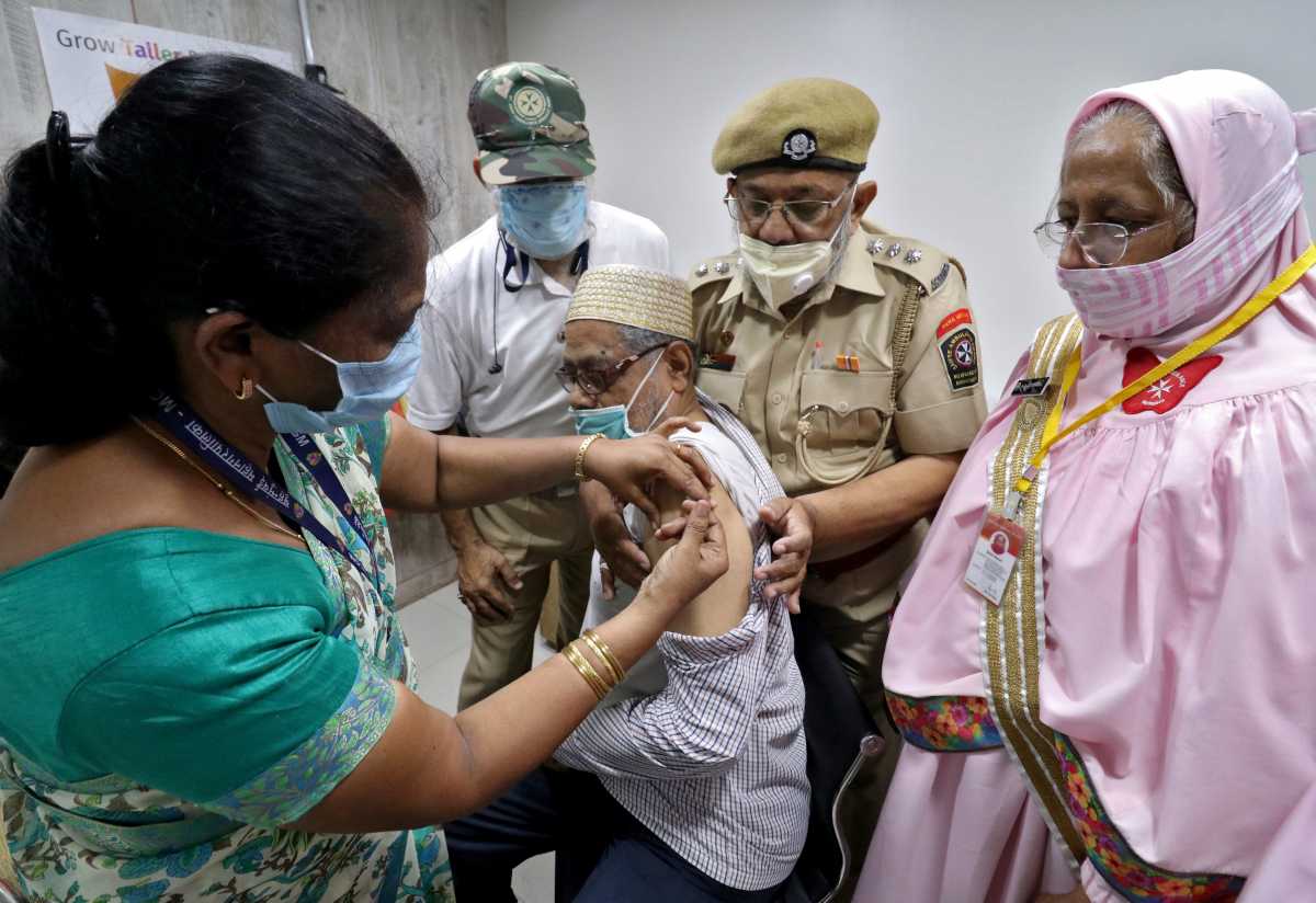 A man receives a dose of COVISHIELD, a coronavirus disease (COVID-19) vaccine manufactured by Serum Institute of India, at a vaccination centre in Mumbai, India, May 6, 2021. REUTERS