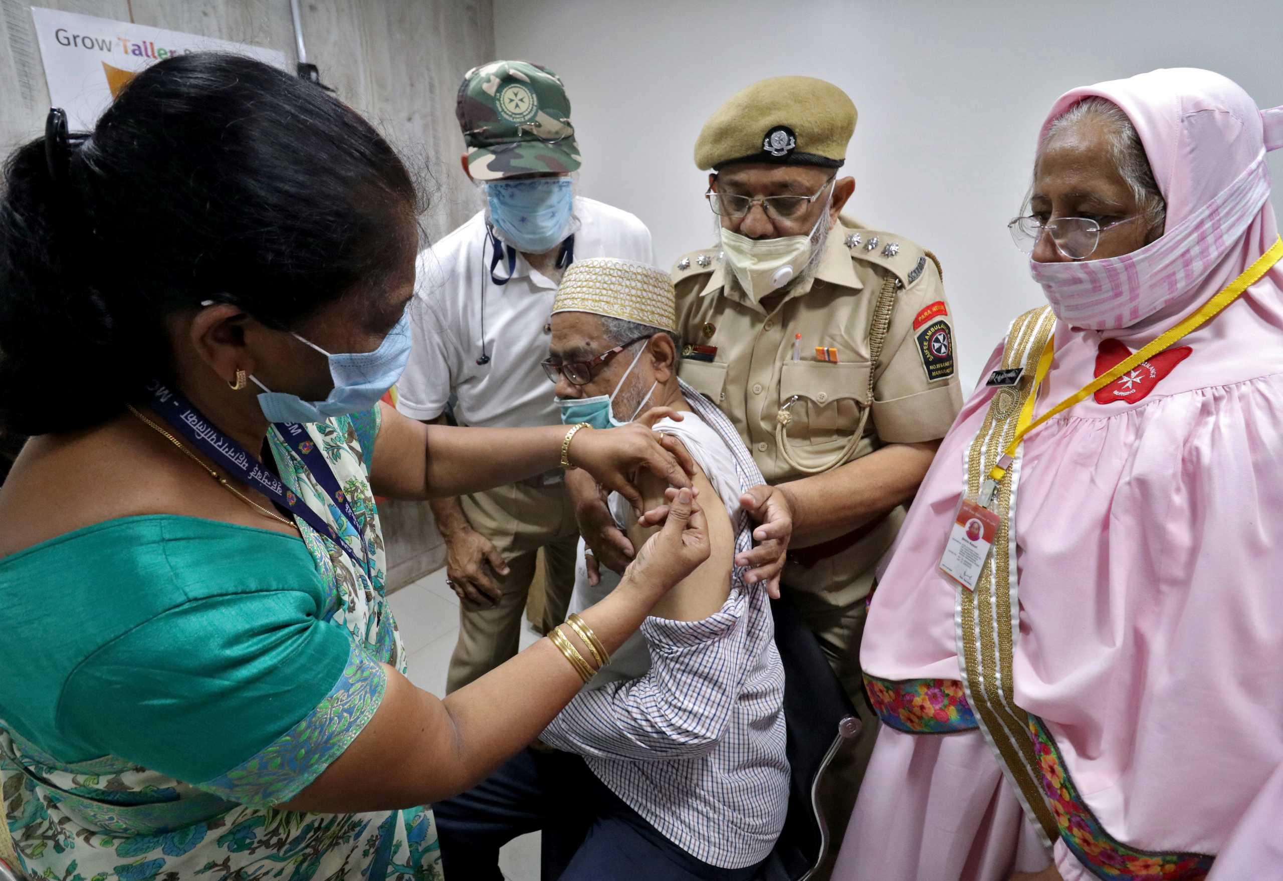 A man receives a dose of COVISHIELD, a coronavirus disease (COVID-19) vaccine manufactured by Serum Institute of India, at a vaccination centre in Mumbai, India, May 6, 2021. REUTERS