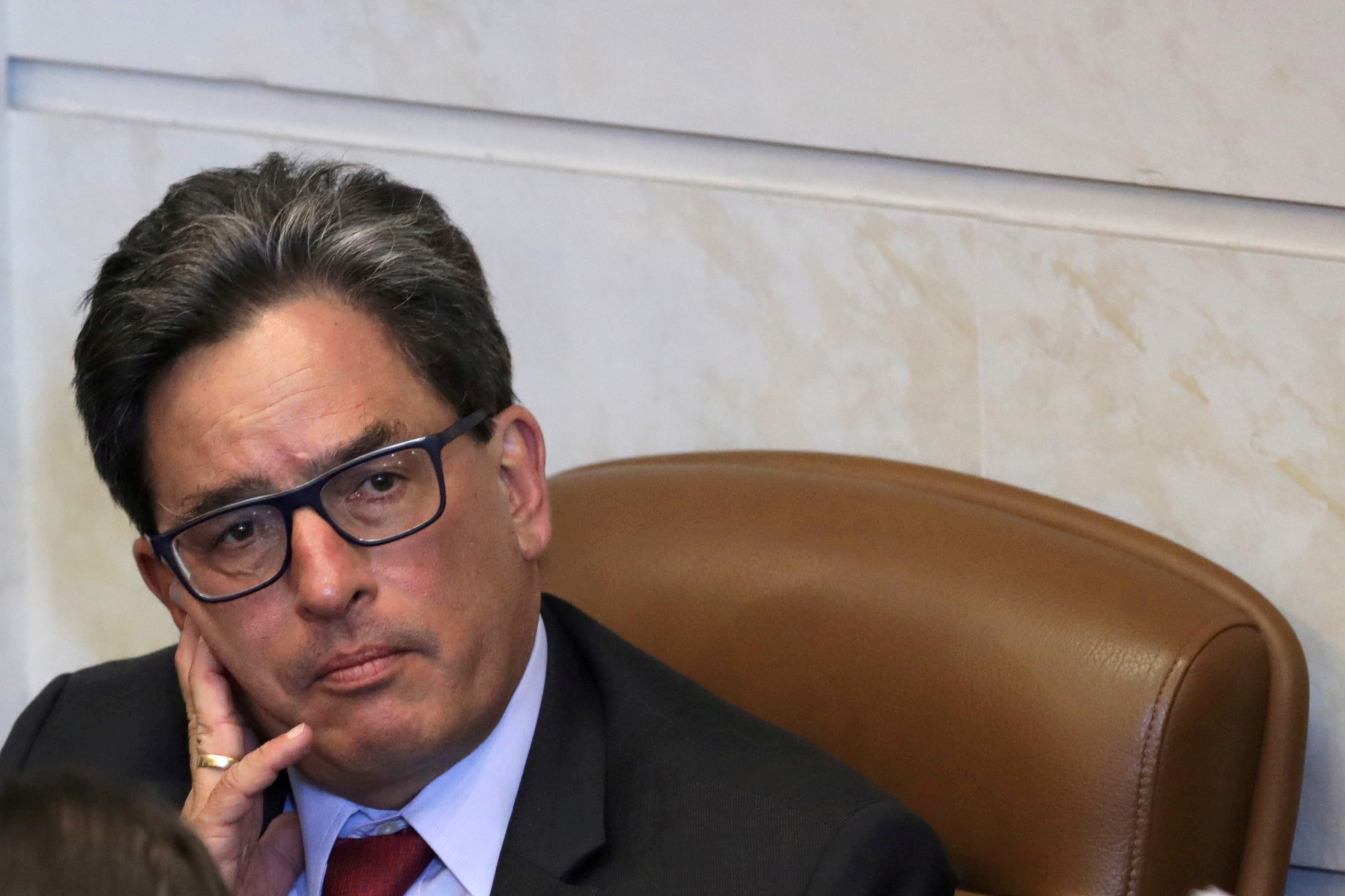 FILE PHOTO: Colombian Finance Minister Alberto Carrasquilla Barrera attends a tax reform bill debate at the congress building in Bogota, Colombia December 18, 2018. REUTERS