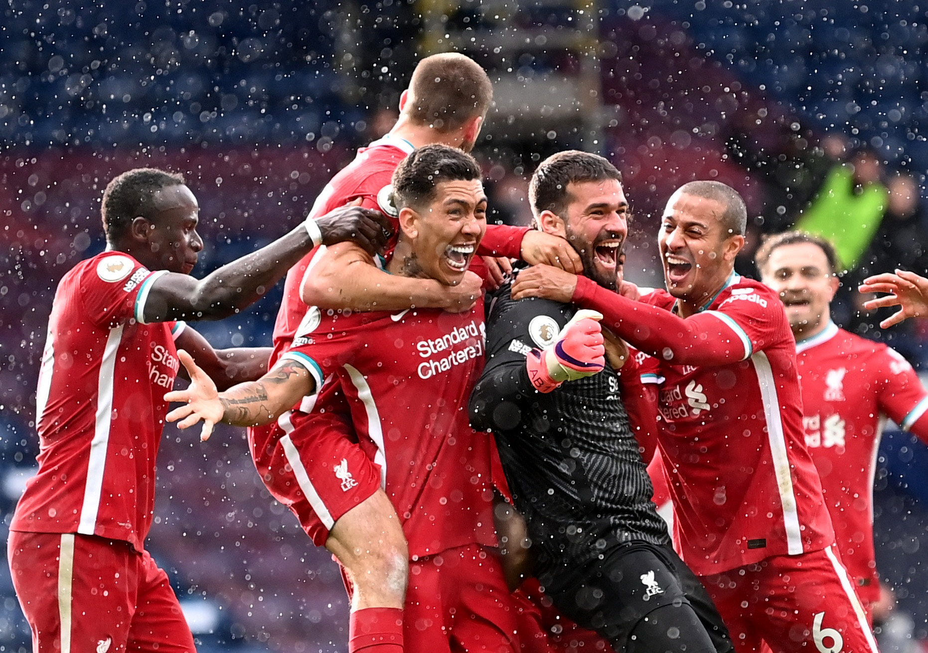 Soccer Football - Premier League - West Bromwich Albion v Liverpool - The Hawthorns, West Bromwich, Britain - May 16, 2021 Liverpool's Alisson celebrates scoring their second goal with teammates Pool via REUTERS