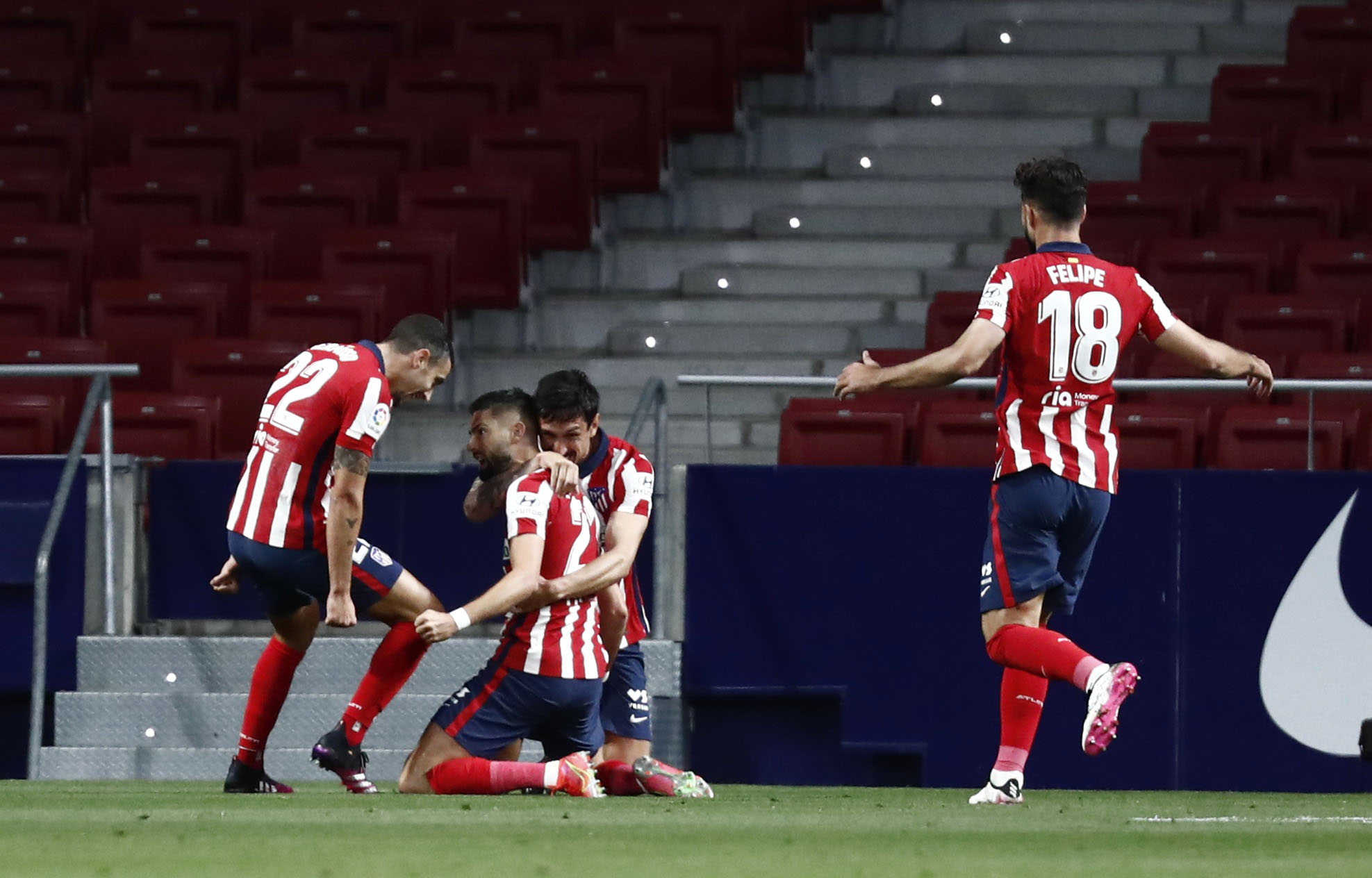 Soccer Football - La Liga Santander - Atletico Madrid v Real Sociedad - Wanda Metropolitano, Madrid, Spain - May 12, 2021 Atletico Madrid's Yannick Carrasco celebrates scoring their first goal with teammates REUTERS