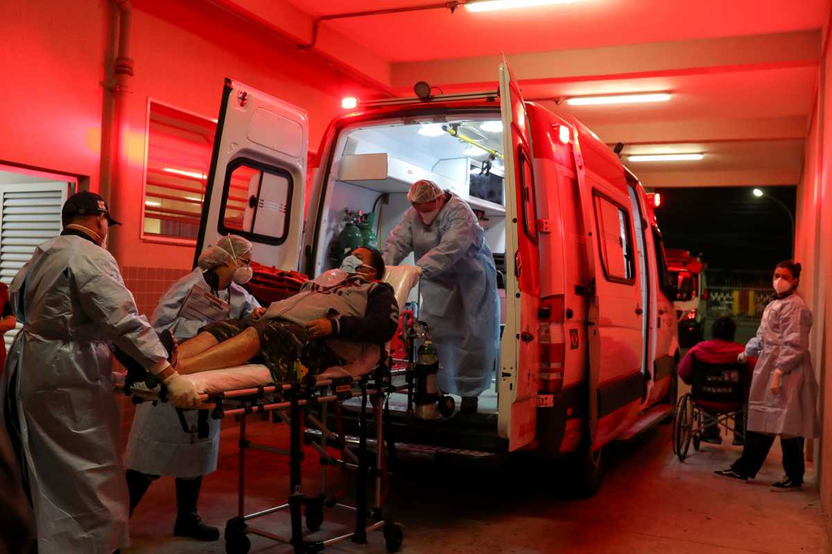 Members of an Emergency Mobile Care Service (SAMU) team take a couple from the ambulance to an UPA (Emergency Service Unit) to be treated for the symptoms of the coronavirus disease (COVID-19), in Sao Paulo, Brazil May 3, 2021. REUTERS