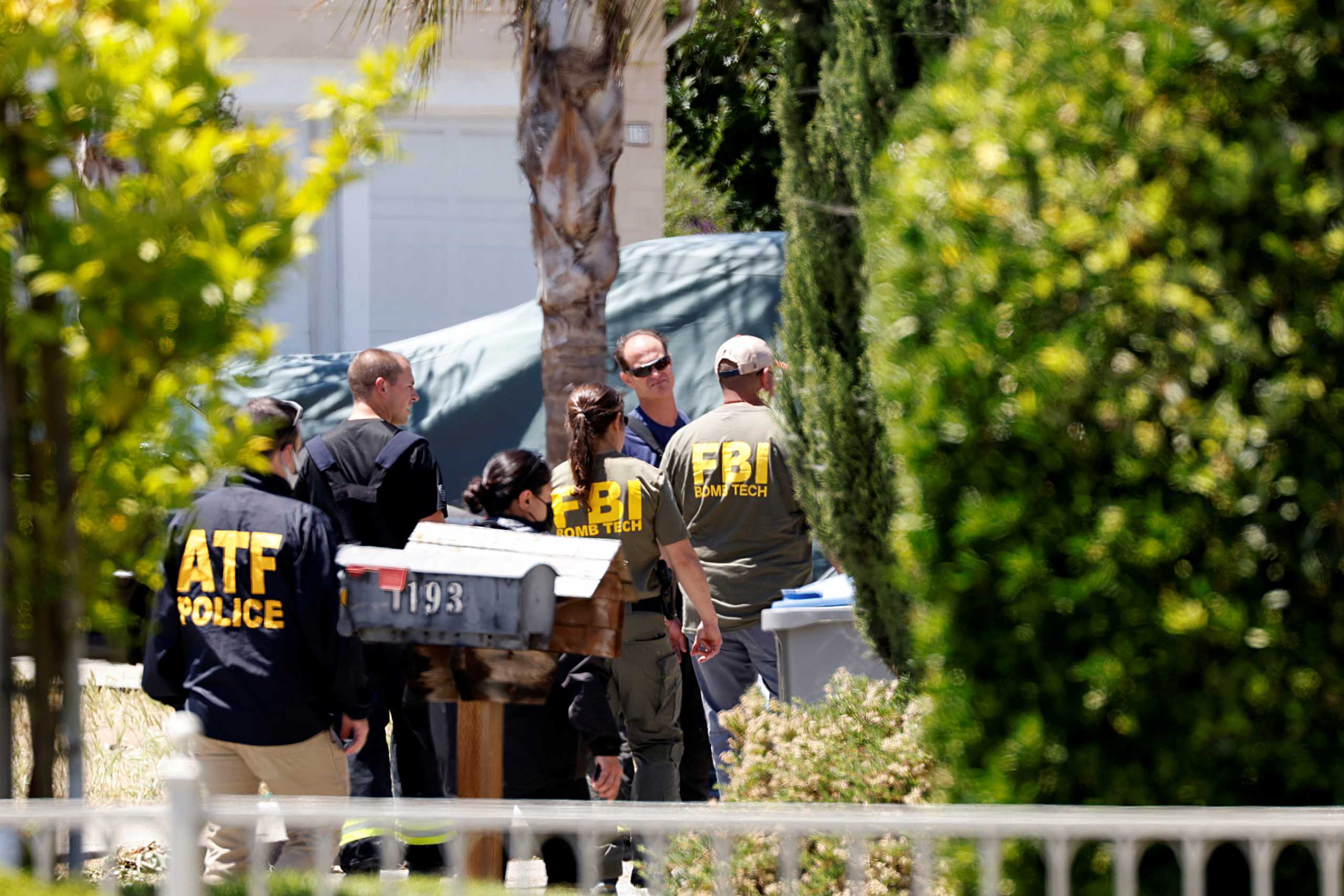 ATF and FBI agents approach the scene of the Santa Clara Valley Transportation Authority mass shooting suspect's house, after a fire at the home of the suspect erupted at about the same time as the shooting, in San Jose, California, U.S. May 26, 2021. REUTERS