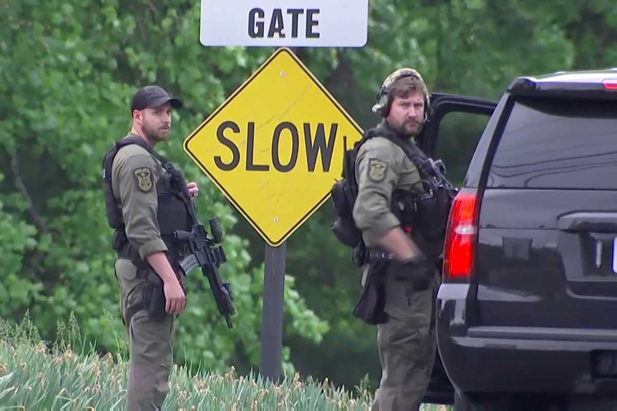 Law enforcement officers guard near the entrance to the headquarters of the Central Intelligence Agency (CIA) after a security incident in Langley, Virginia, U.S. May 3, 2021 in a still image from video.   NBC News via REUTERS NO RESALES. NO ARCHIVES. MANDATORY CREDIT