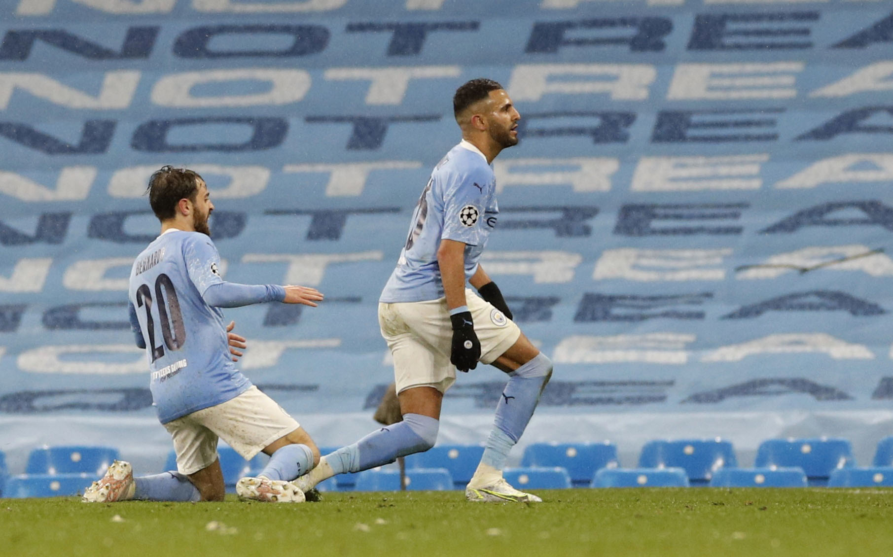 Soccer Football - Champions League - Semi Final Second Leg - Manchester City v Paris St Germain - Etihad Stadium, Manchester, Britain - May 4, 2021 Manchester City's Riyad Mahrez celebrates scoring their second goal with Bernardo Silva REUTERS