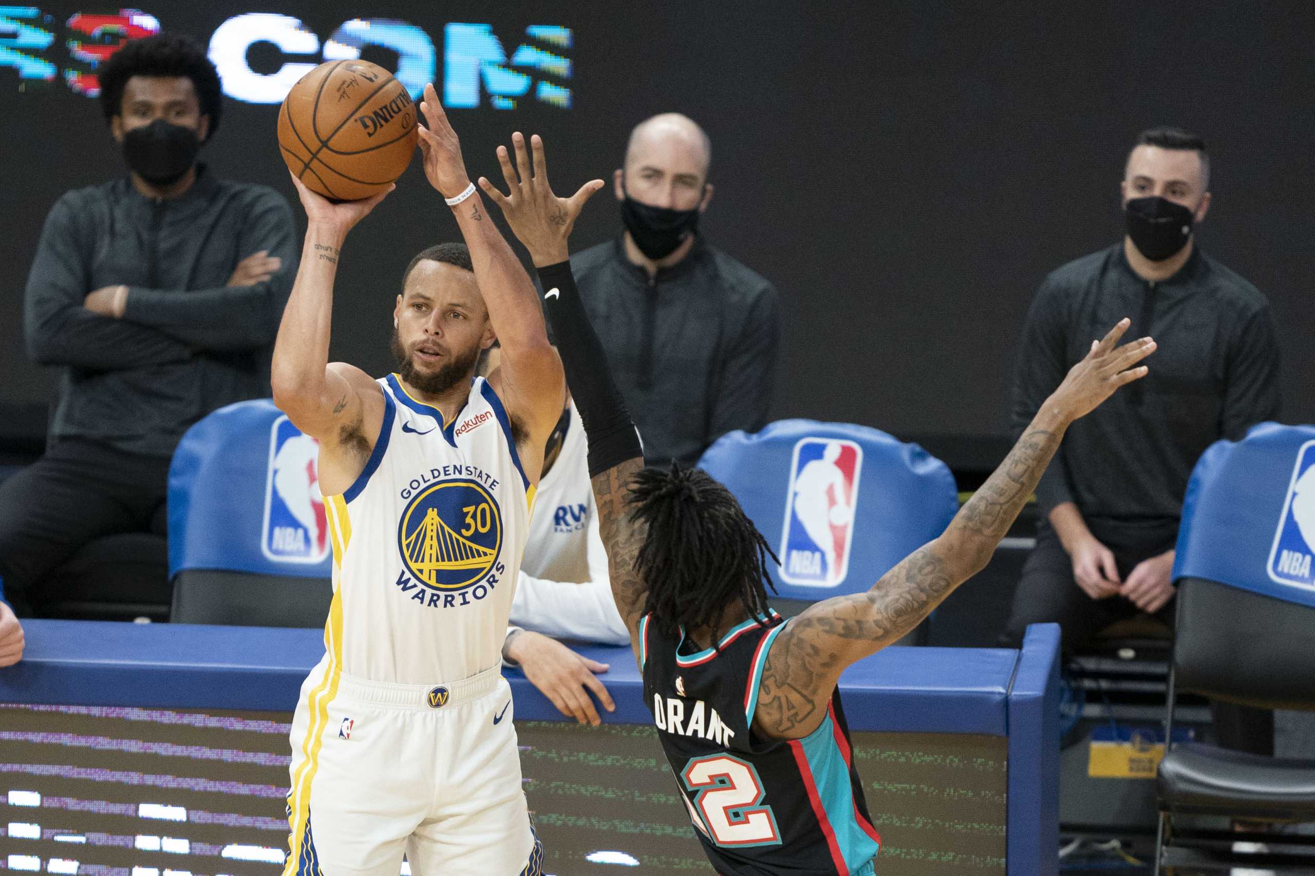 May 16, 2021; San Francisco, California, USA; Golden State Warriors guard Stephen Curry (30) shoots the basketball against Memphis Grizzlies guard Ja Morant (12) during the third quarter at Chase Center. Mandatory Credit: Kyle Terada-USA TODAY Sports