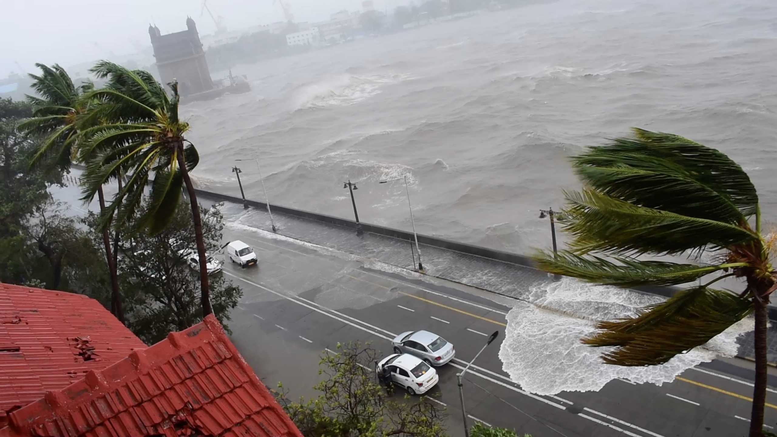 Waves crash onto the road as Cyclone Tauktae batters Mumbai, India May 17, 2021 in this still image taken from social media video. Twitter @ompsyram via REUTERS  THIS IMAGE HAS BEEN SUPPLIED BY A THIRD PARTY. NO RESALES. NO ARCHIVES. MANDATORY CREDIT