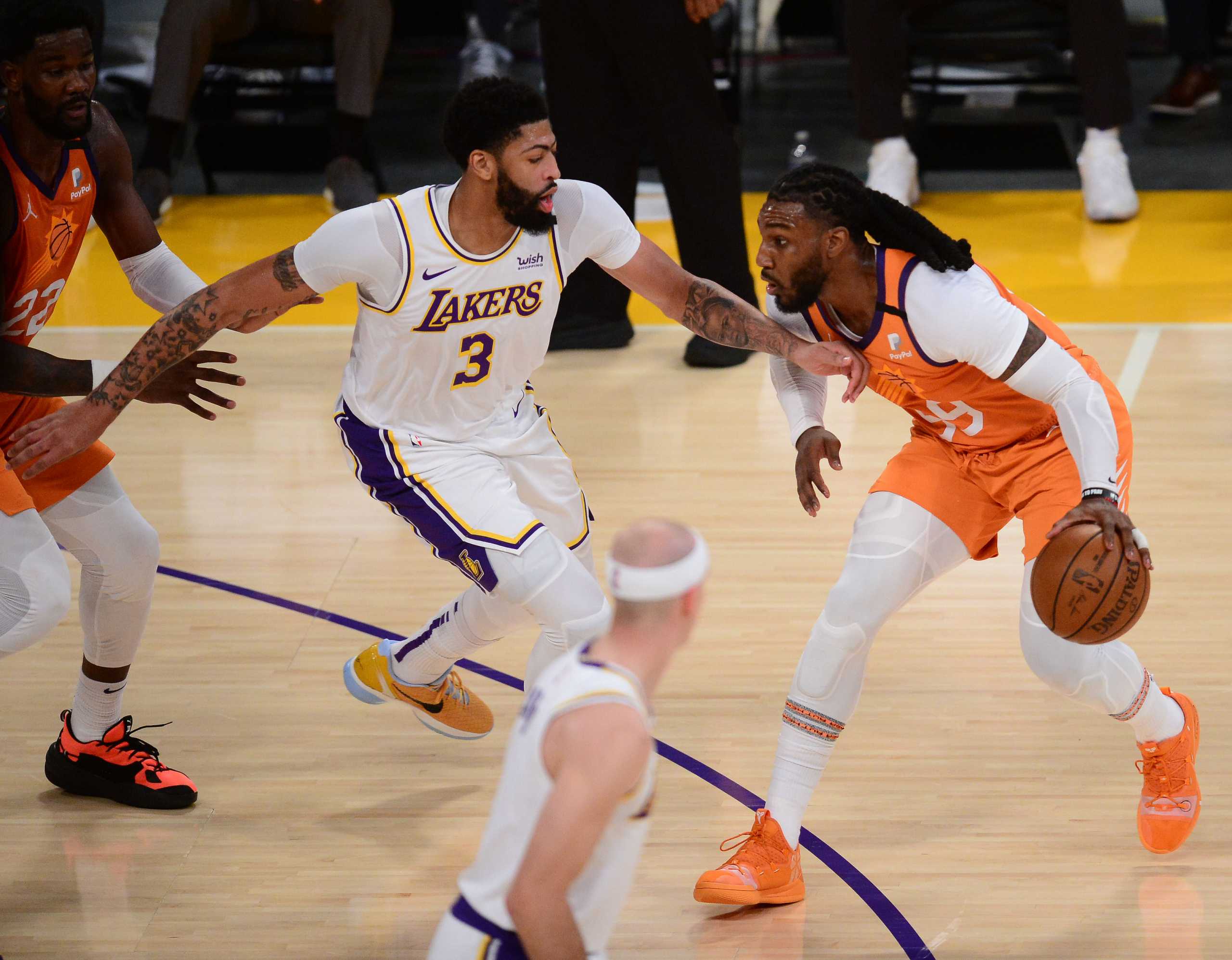 May 30, 2021; Los Angeles, California, USA; Phoenix Suns forward Jae Crowder (99) controls the ball against Los Angeles Lakers forward Anthony Davis (3) during the first half in game four of the first round of the 2021 NBA Playoffs. at Staples Center. Mandatory Credit: Gary A. Vasquez-USA TODAY Sports