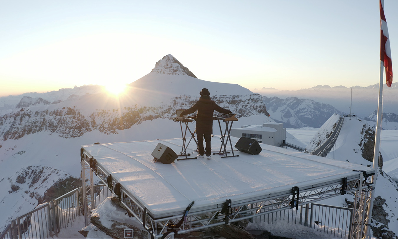 A screen grab from a video released by Cercle shows DJ Teho performing his song at Glacier 3000 in Les Diablerets, Switzerland, April 23, 2021. Cercle Production