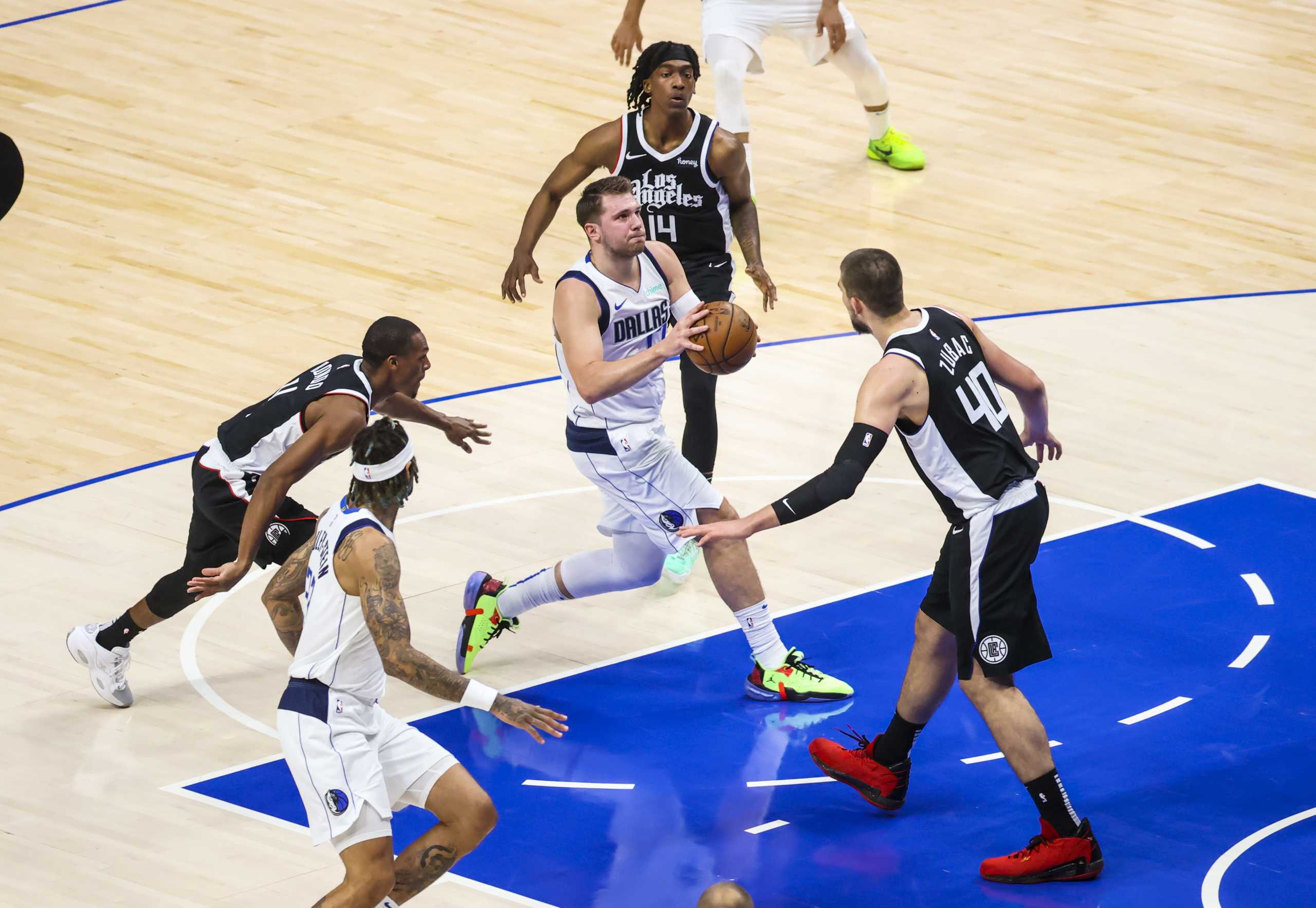 May 30, 2021; Dallas, Texas, USA; Dallas Mavericks guard Luka Doncic (77) shoots as LA Clippers center Ivica Zubac (40) defends during the first quarter in game four in the first round of the 2021 NBA Playoffs at American Airlines Center. Mandatory Credit: Kevin Jairaj-USA TODAY Sports