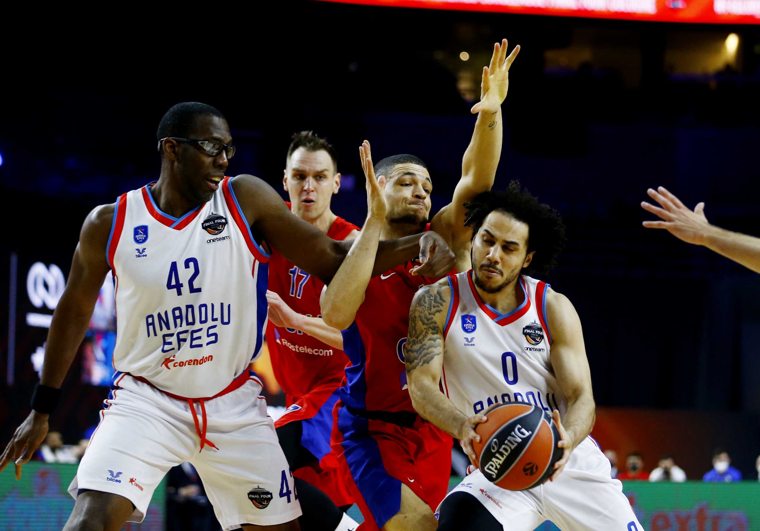Basketball - Euroleague Final Four - CSKA Moscow v Anadolu Efes - Lanxess Arena, Cologne, Germany - May 28, 2021 CSKA Moscow's Johannes Voigtmann and Iffe Lundberg in action with Anadolu Efes' Shane Larkin and Bryant Dunston REUTERS