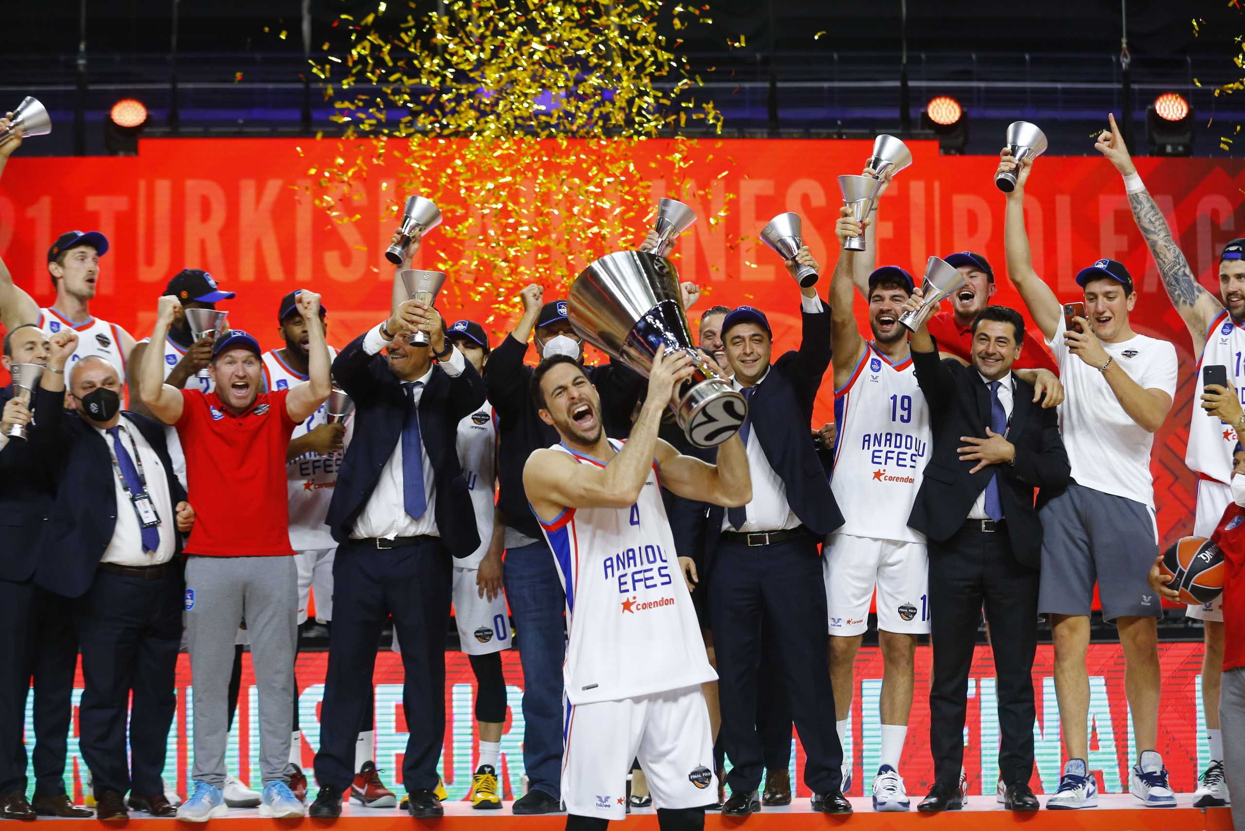 Basketball - Euroleague Final - FC Barcelona v Anadolu Efes Istanbul - Lanxess Arena, Cologne, Germany - May 30, 2021 Anadolu Efes Istanbul's Dogus Balbay celebrates with the trophy and teammates after winning the Euroleague REUTERS