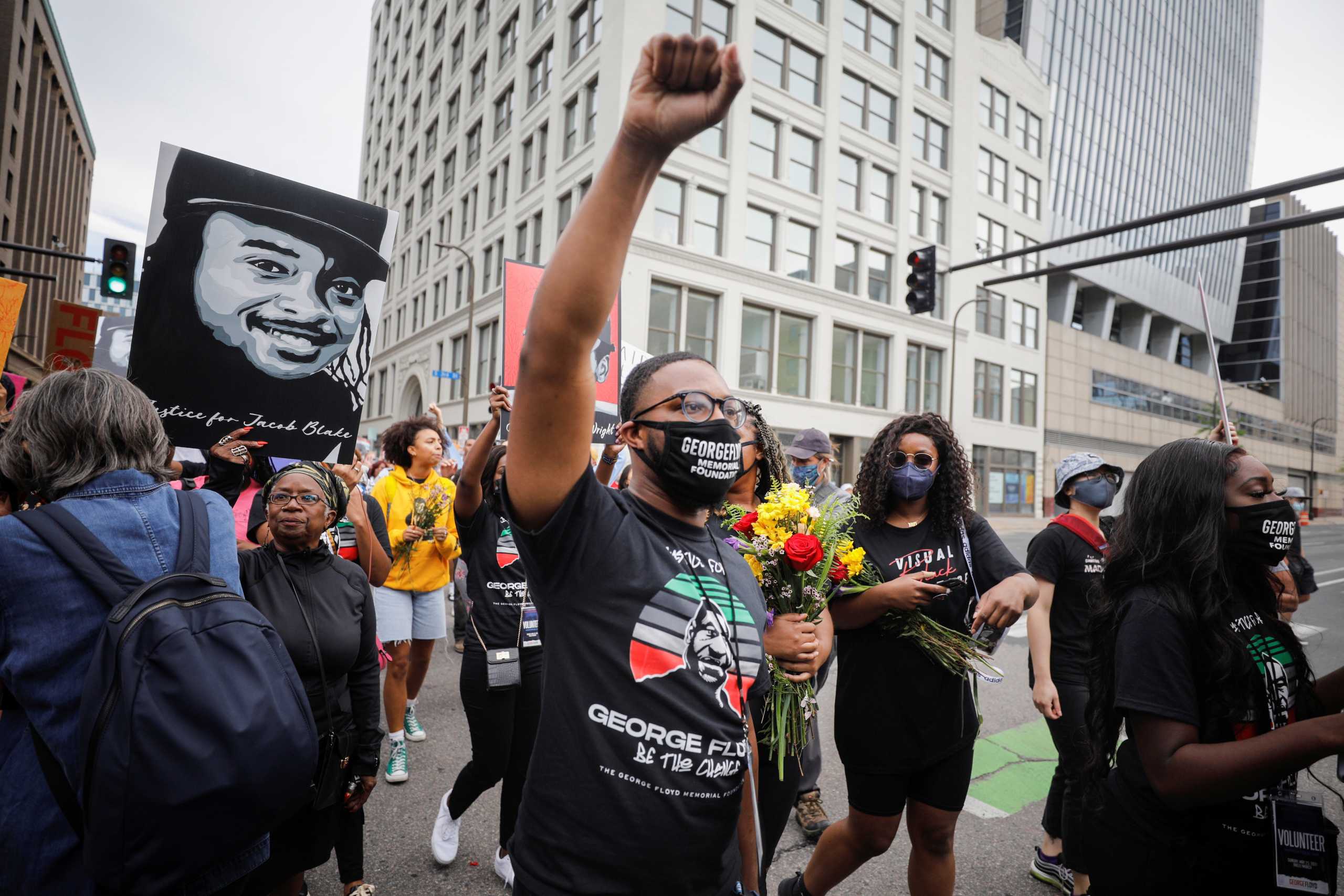People march during the "One Year, What's Changed?" rally hosted by the George Floyd Global Memorial to commemorate the first anniversary of his death, in Minneapolis, Minnesota, U.S. May 23, 2021. REUTERS