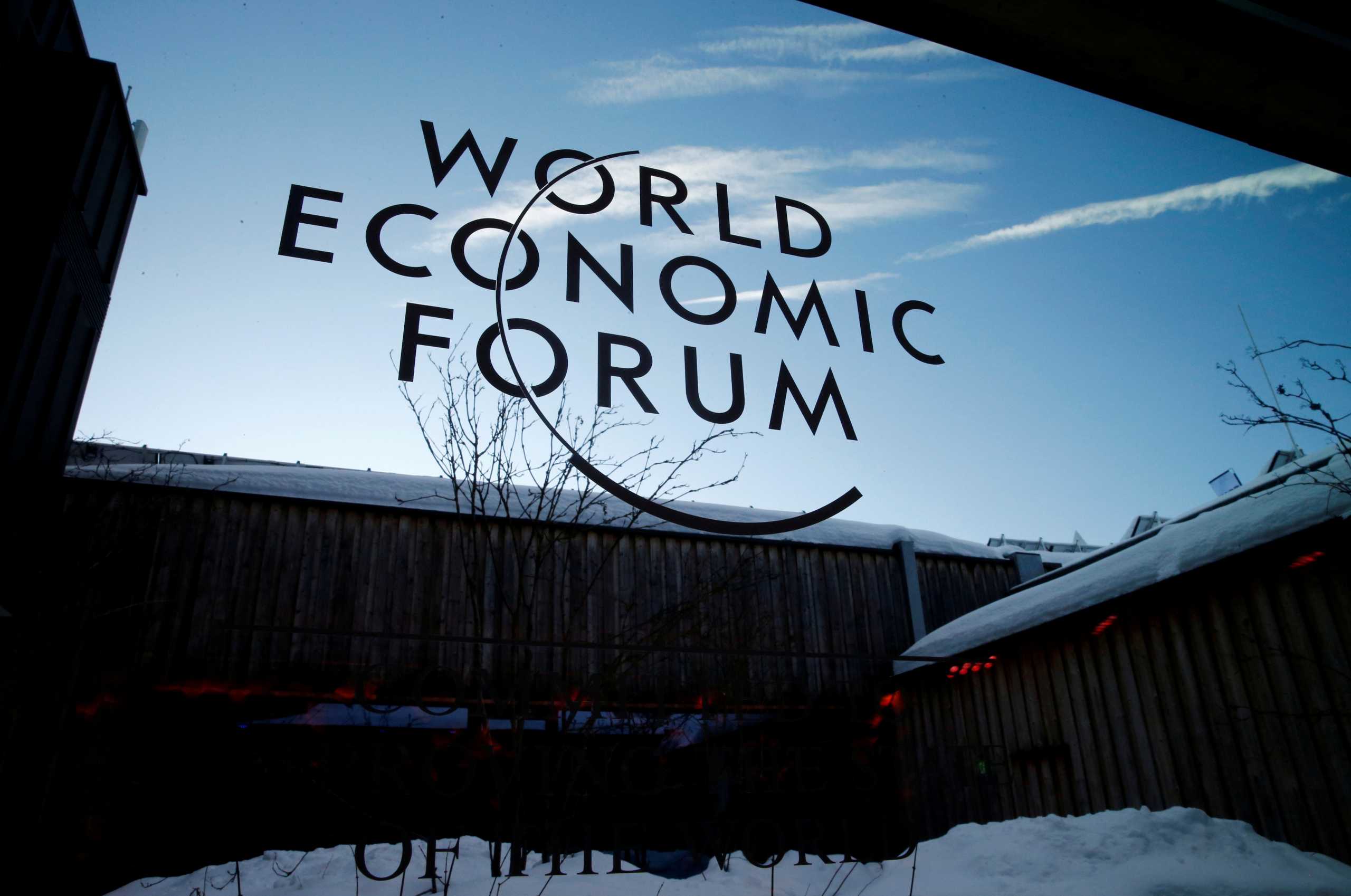 FILE PHOTO: A logo of the 50th World Economic Forum (WEF) annual meeting is pictured on a window in Davos, Switzerland, January 21, 2020. REUTERS
