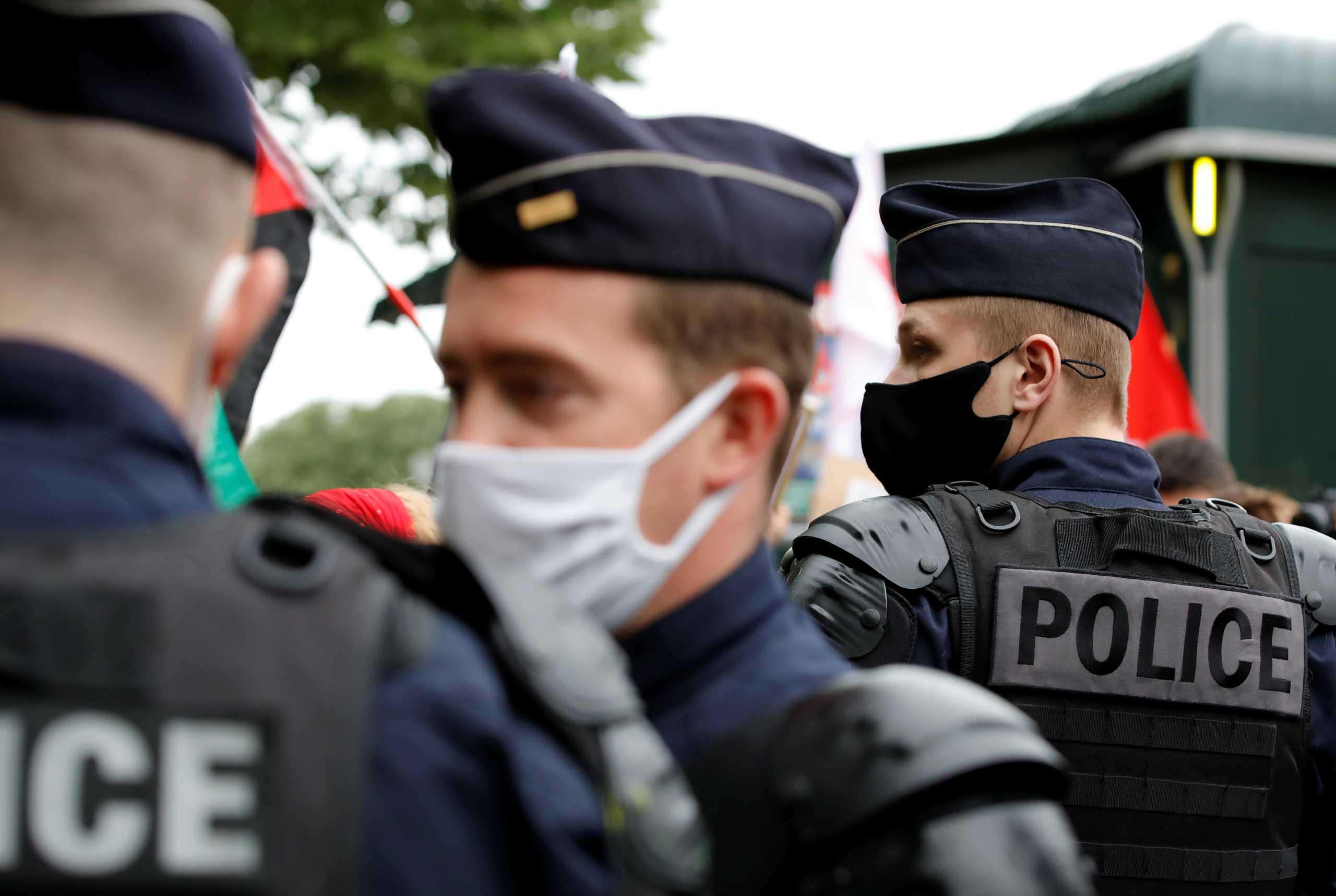 French police stand guard during a protest, following a flare-up of Israeli-Palestinian violence, in Paris, France, May 12, 2021. REUTERS