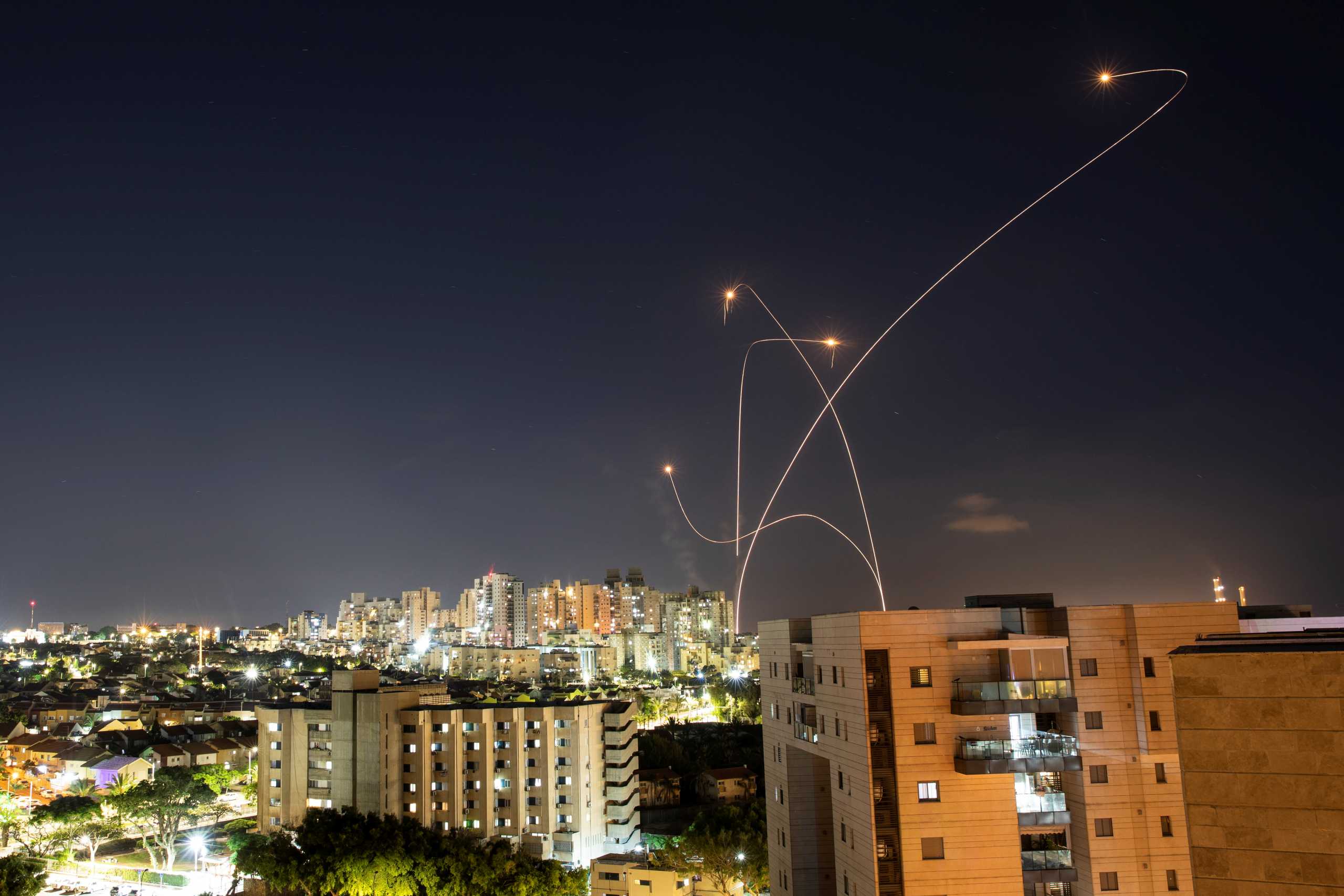 Streaks of light are seen as Israel's Iron Dome anti-missile system intercepts rockets launched from the Gaza Strip towards Israel, as seen from Ashkelon, Israel May 14, 2021. REUTERS
